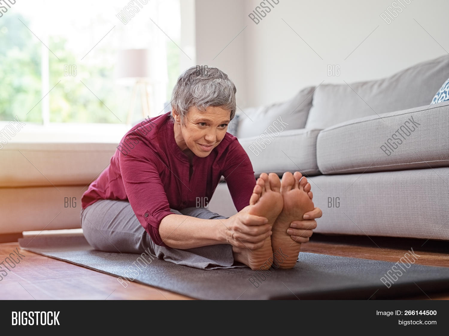 active,activity,aging,barefoot,beautiful woman,body,care,caucasian,concentration,elder,elderly,elderly woman,exercise,feet,fit,fitness,fitness woman,flexibility,gray hair,health,health care,healthcare,healthy,holding,home,leaning,mature,matured,old,old woman,pensioner,people,practice,retired,retirement,senior,sitting,sport,strength,stretch,touching feet,training,workout,yoga,yoga poses