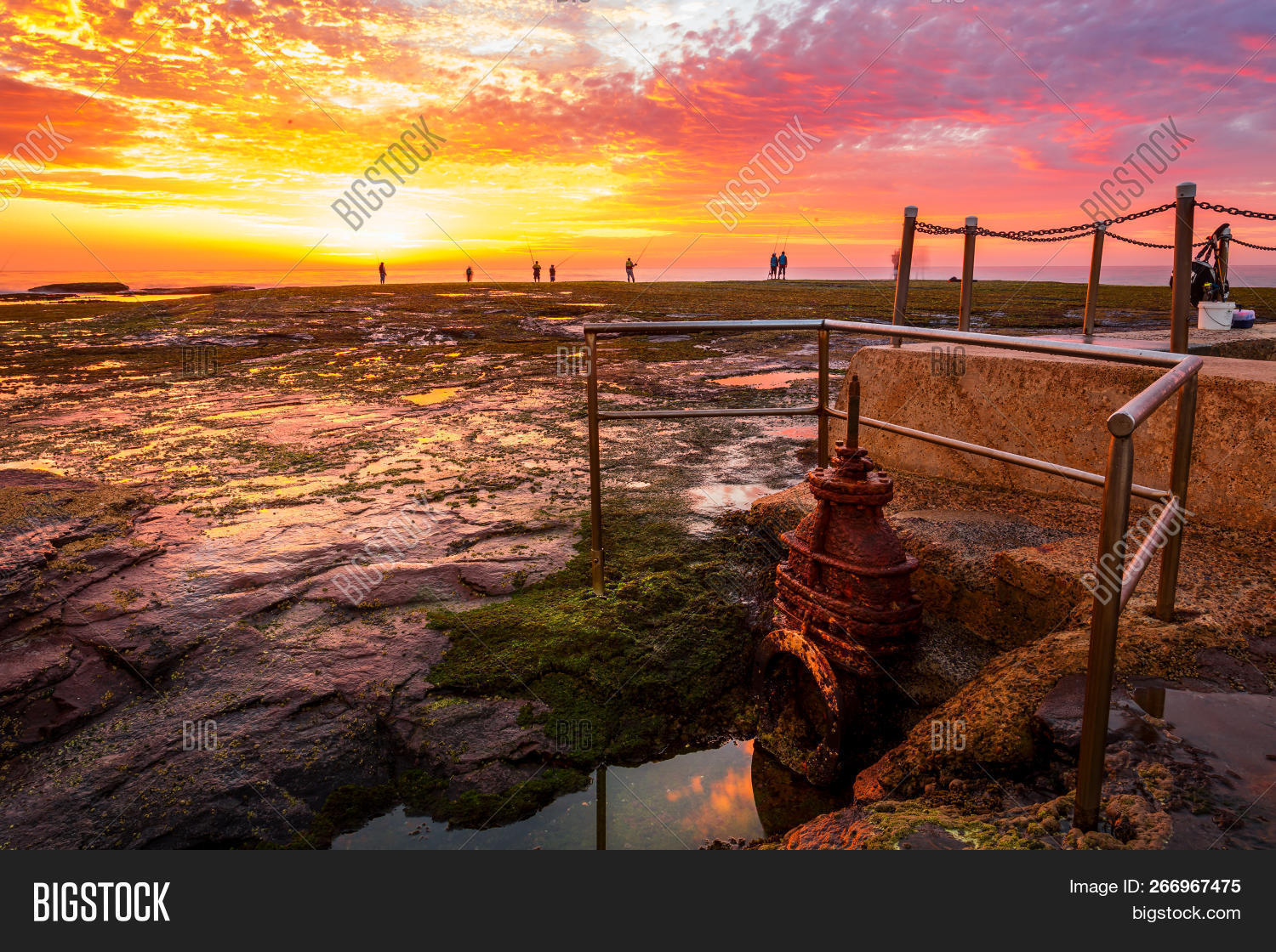 Sunrise And Fisherman Silhouetted At Mona Vale Rock Shelf
