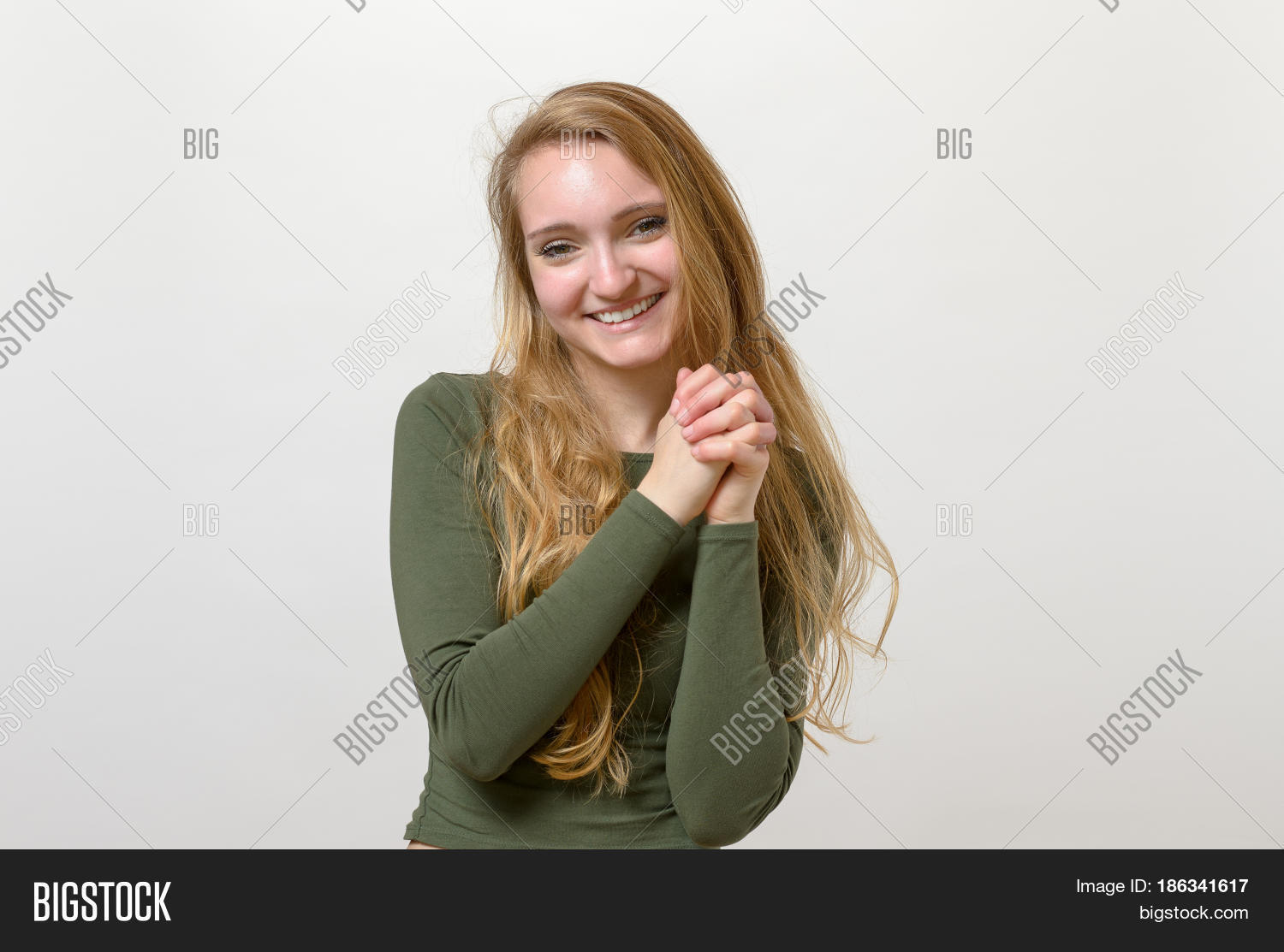 Emotion,acknowledgement,appreciation,attractive,background,beholden,blond,communication,expression,face,female,girl,grateful,gratitude,hands,heart,heartfelt,isolated,person,pleased,sincere,student,thankful,thanks,white,woman,young