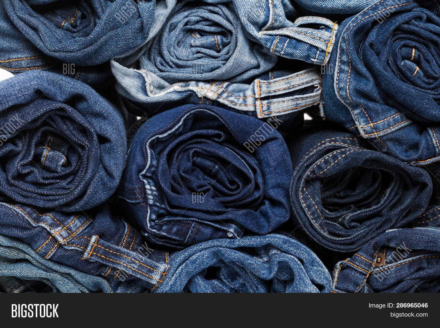 apparel,background,blue,bluejeans,bottoms,casual,closeup,cloth,clothes,clothing,color,cotton,dark,denim,design,detail,fabric,fashion,fold,folded,garment,group,isolated,jeans,light,material,modern,navy,old,outerwear,outfit,pair,pants,pile,pocket,rivet,sale,seam,shop,slacks,stack,store,style,textile,texture,trousers,wardrobe,wear,white