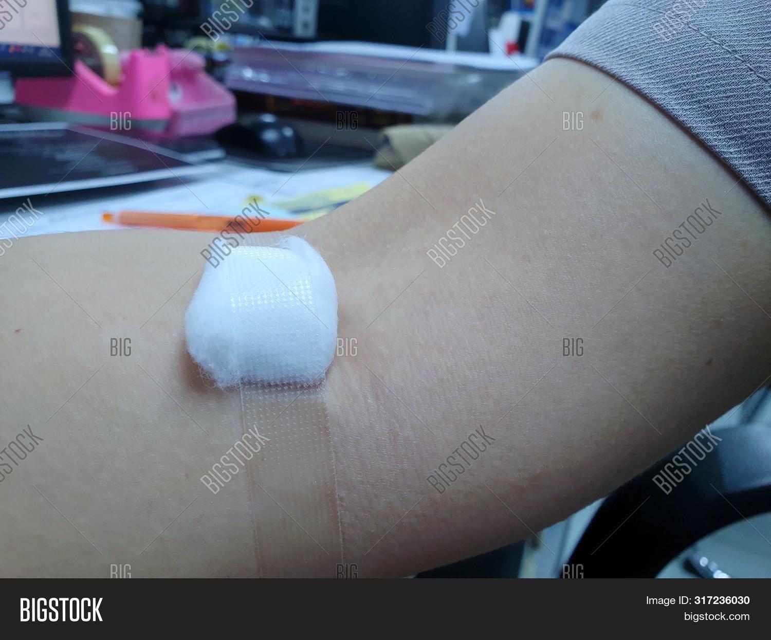 accident,adhesive,adult,aid,analysis,arm,background,blood,body,care,clinic,closeup,collection,color,concept,contusion,cotton,cure,design,disease,donation,drill,expertise,gauze,hand,heals,health,help,hospital,human,illness,injection,injury,insult,isolated,lesion,medical,medicine,pain,people,physician,plaster,puncture,scar,therapy,top,trauma,white,woman,wound