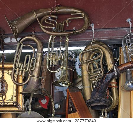 Damaged Beaten Brass Musical Instruments At Flea Market