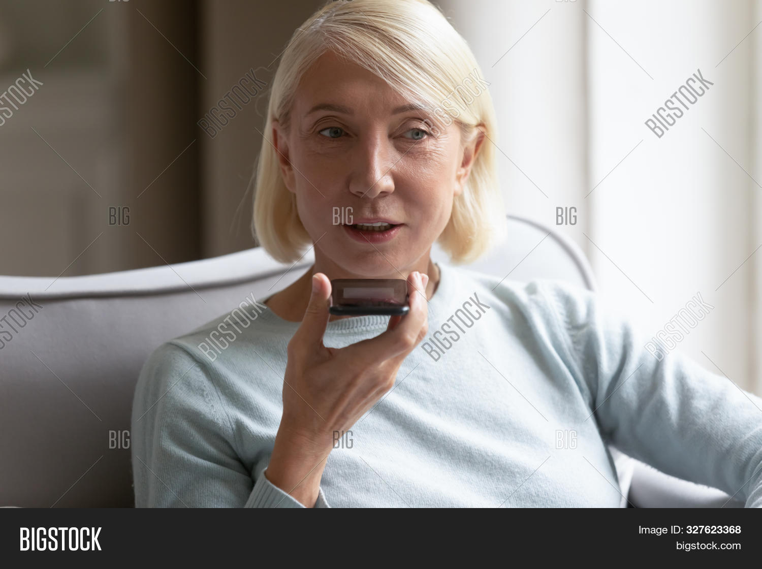 50s,60s,activate,adult,aged,app,application,assistant,business,businesswoman,client,command,communication,couch,cozy,device,elderly,female,grandma,grandmother,granny,happy,headshot,lady,living,mature,message,mic,middle,mobile,old,older,person,phone,record,retired,room,searching,sending,senior,smiling,sofa,software,speaking,technology,translator,using,virtual,voice,woman