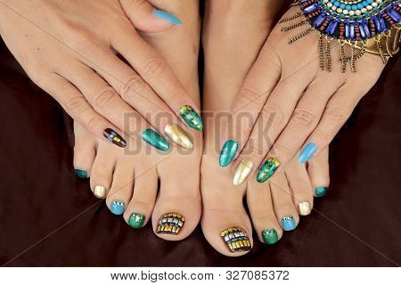 Multicolored Pedicure And Manicure With Rhinestones On Oval Long Female Nails.nail Design With Turqu