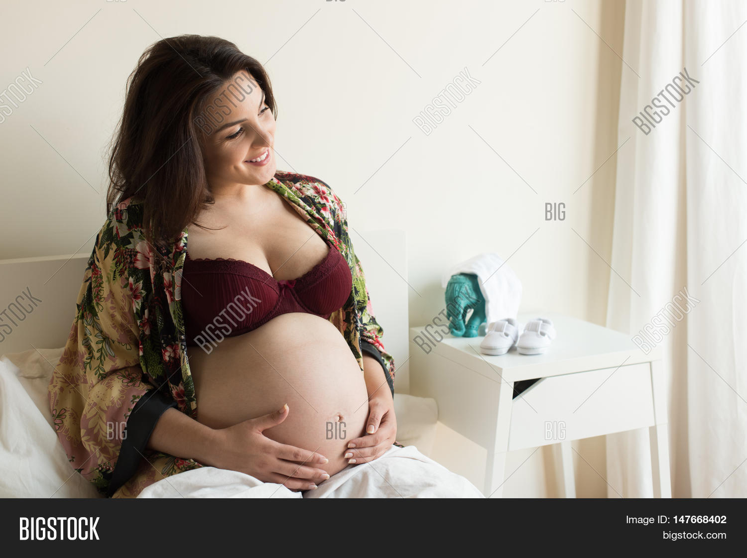 pregnant,woman,bed,pregnancy,home,bedroom,belly,female,happy,young,maternity,beautiful,sitting,expecting,touching,adult,white,person,expectant,holding,resting,baby,mother,relaxing,motherhood,tummy,stomach,abdomen,anticipation,due,date,39,weeks,40,full,term,labor,day,delivery,smiling