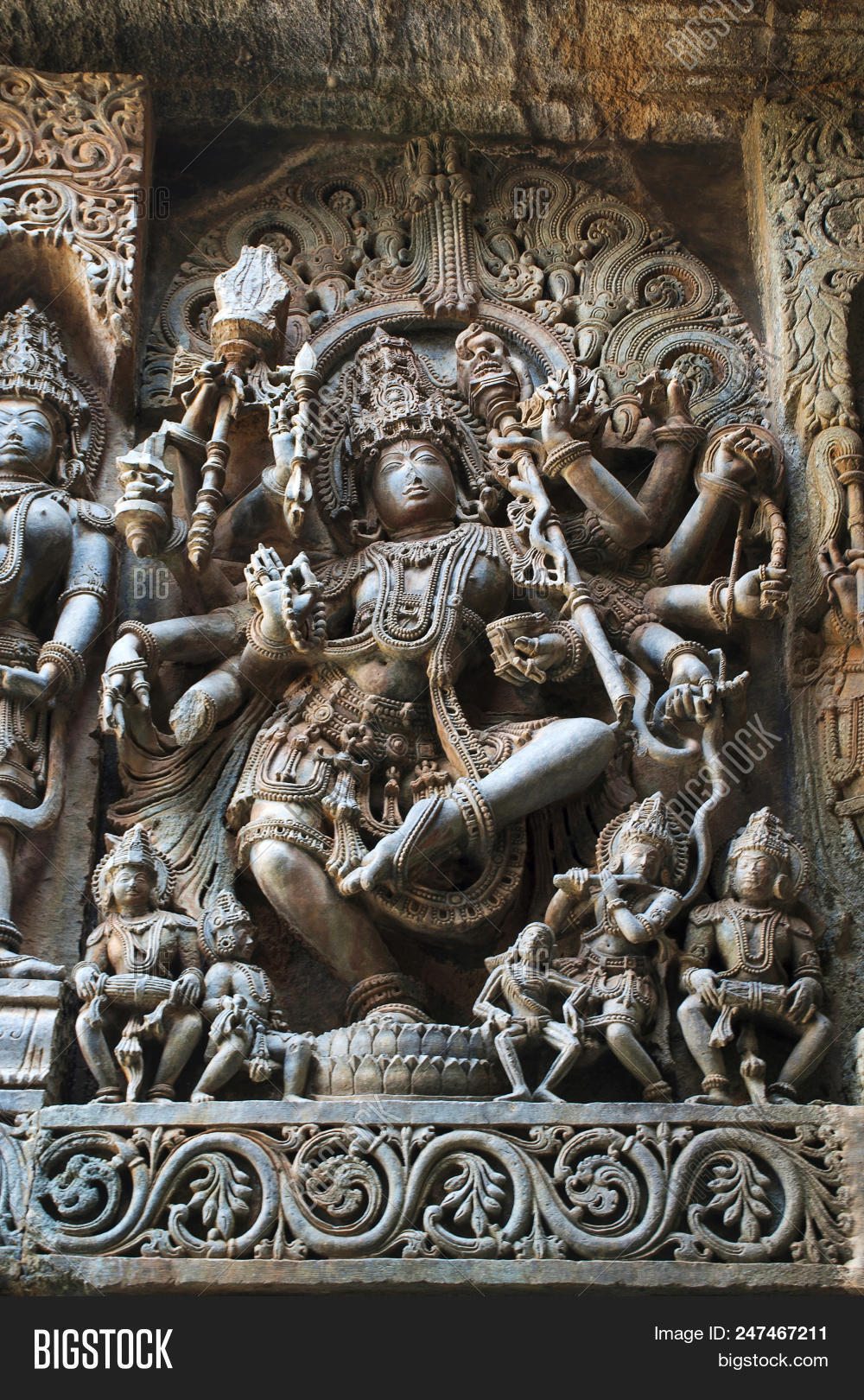 Shiva,archaeological,architectural,architecture,art,asia,carved,carvings,century,color,dance,dancing,deity,design,dorasamudra,empire,exterior,god,halebeedu,halebid,halebidu,halibedu,heritage,hindu,hinduism,historic,history,hoysala,hoysaleswara,india,indian,intricate,karnataka,locations,relief,religion,ruins,sculpture,shape,stone,temple,travel,wall,world