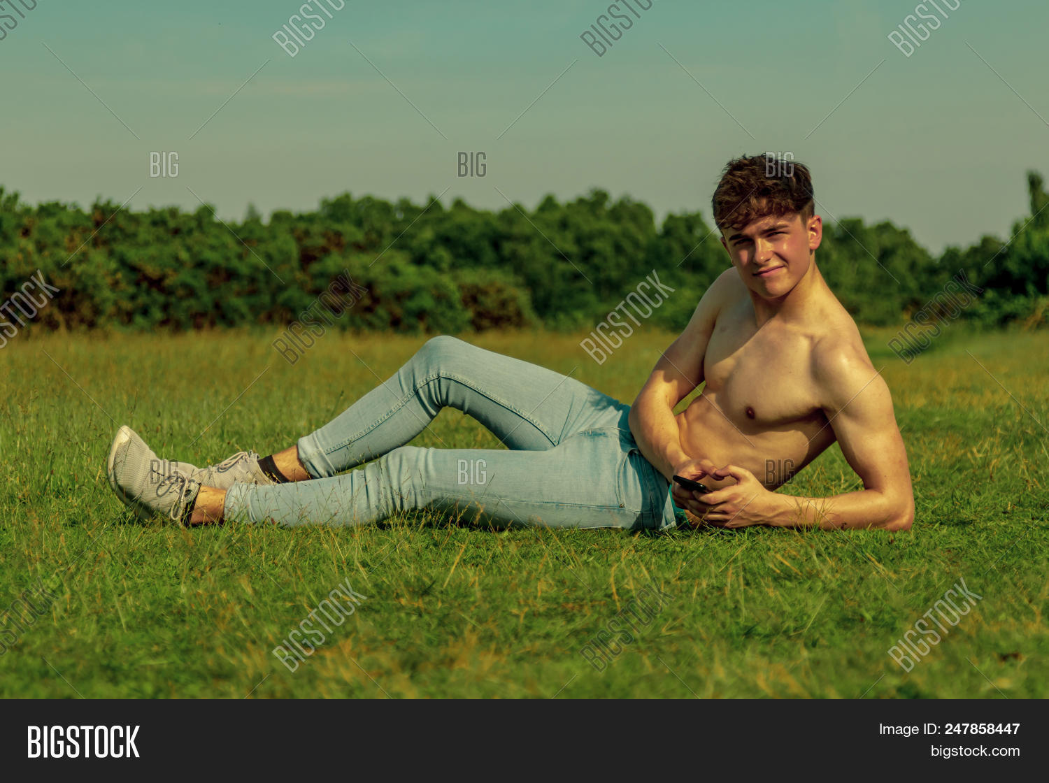 17-18,18-20,Boy,Cellular,adult,afternoon,age,aged,bare,bright,cell,chest,college,day,grass,high,hot,male,man,mobile,model,muscles,muscular,naked,old,outdoors,outside,park,parkland,phone,school,student,summer,sun,sunbathe,sunbathing,sunlight,sunny,sunshine,teen,teenage,teenager,temperature,torso,university,warm,years,young,youth