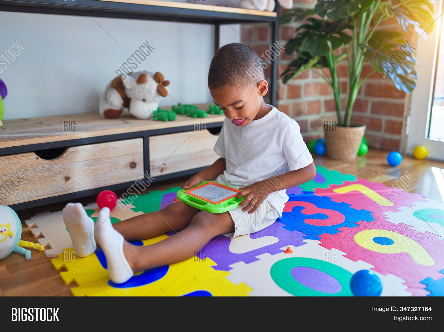adorable,african,afro,american,beautiful,board,boy,child,childcare,childhood,children,colorful,creative,cute,development,digital,draw,drawing,education,educational,face,floor,funny,game,happy,home,indoors,joy,kid,kindergarten,learning,montessori,nursery,person,play,play school,playful,playroom,playtime,preschool,preschooler,room,school,sitting,technology,toddler,toy,toys,window