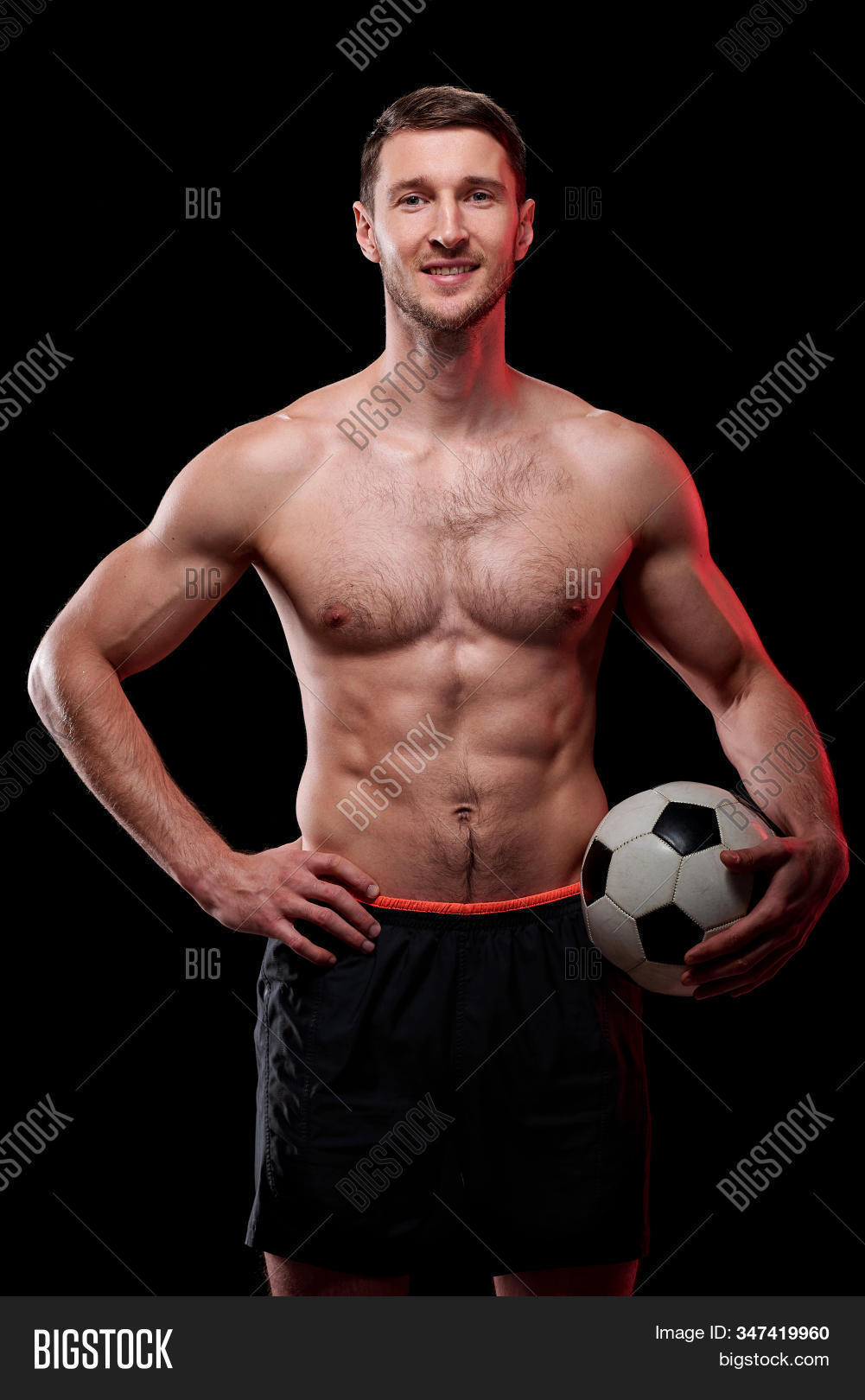 abdominal muscle,action,activity,adult,athlete,backgrounds,ball,beautiful,black background,black color,body building,caucasian ethnicity,chest,competition,competitive sport,exercising,front view,healthy lifestyle,holding,human muscle,isolated,isolated on black,lifestyles,looking at camera,macho,male beauty,males,masculinity,men,muscular build,one person,people,playing,portrait,posing,professional sport,shirtless,soccer,soccer ball,sport,sports clothing,sports training,sportsman,standing,strength,studio shot,the human body,torso,young adult