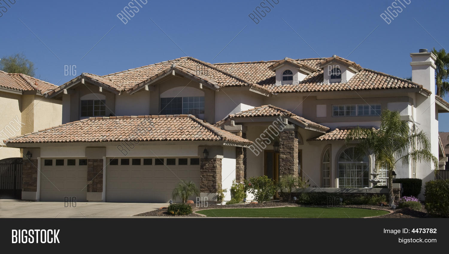 adobe,architecture,arizona,blue,chimney,community,driveway,dwelling,exterior,front,garage,grass,green,home,house,landscaped,modern,outdoors,palm,residential,roof,sky,southwestern,stucco,suburb,tile,tiled,tree,usa,view,windows