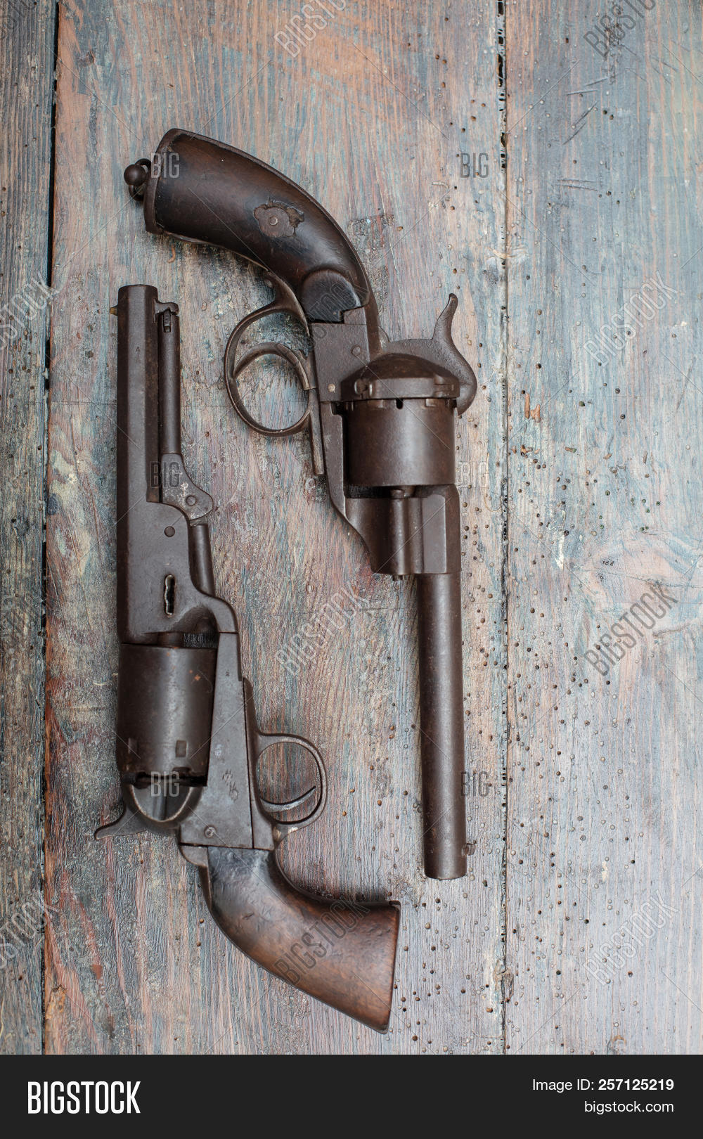 Revolver,Wood,ammunition,antique,army,background,barrel,caliber,circle,collection,colt,copy,cowboy,danger,defense,fire,firearm,frame,full,gun,handgun,history,military,nagant,object,old,pistol,police,poster,protection,retro,security,shoot,shooter,shot,side,space,symbol,table,texture,trigger,view,vintage,war,weapon,west,western,wild