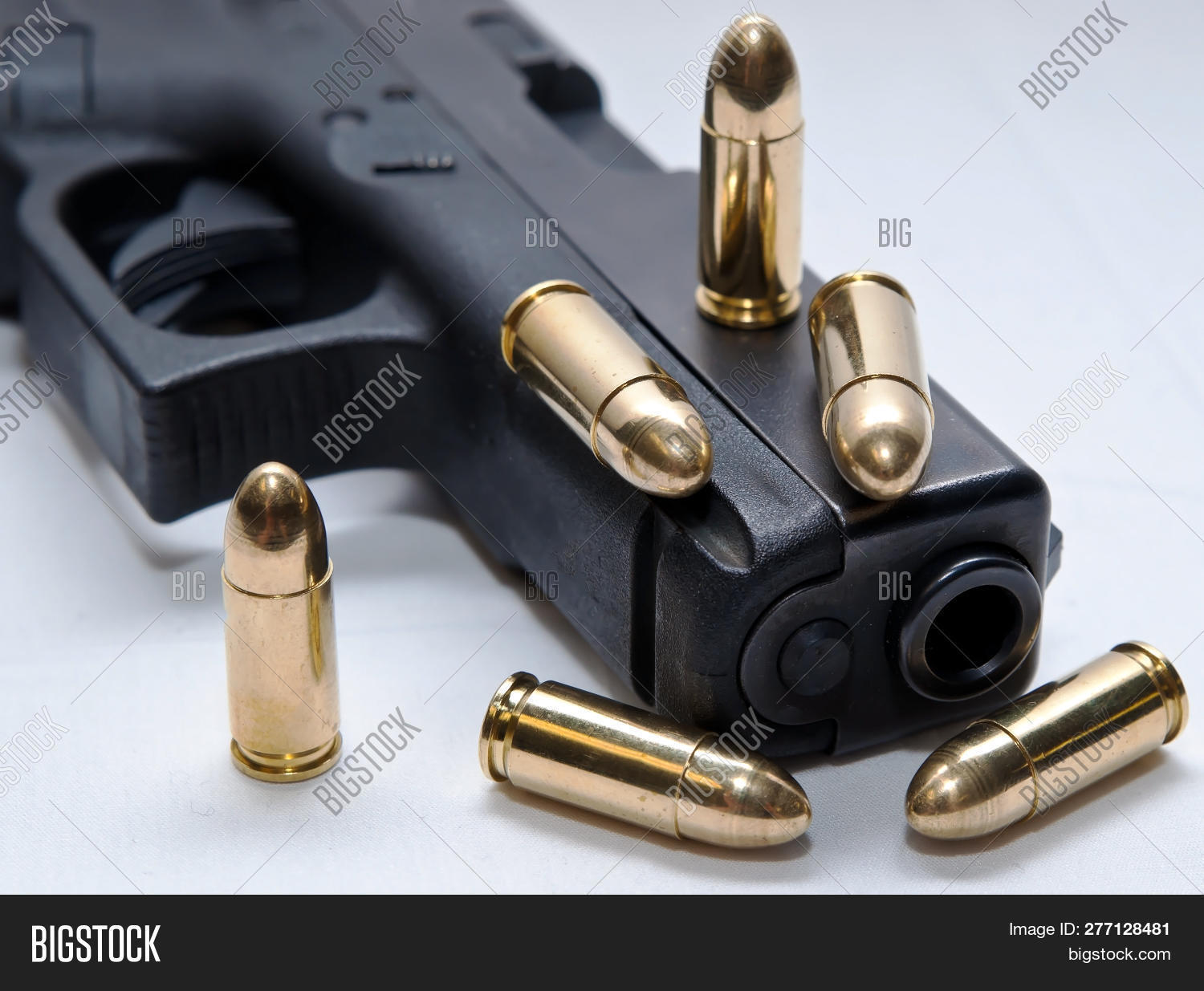 2nd,9mm,amendment,ammo,ammunition,background,black,brass,bullets,firearm,full,gold,gun,jacket,metal,pistol,power,related,second,security,shiny,shot,sidearm,six,studio,white