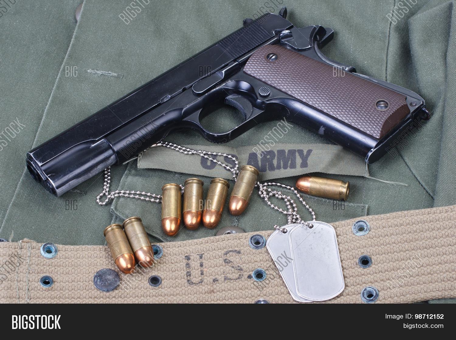 0.50,11,1911,1911a1,43,45,american,ammo,ammunition,army,belt,cal,cartridge,dog,government,gray,grey,gun,handgun,iraq,isolated,korea,legendary,marines,metal,military,object,old,olive,pistol,semi-auto,semi-automatic,side,steel,tags,uniform,us,usa,used,vietnam,weapon,white,ww1,ww2,wwi,wwii