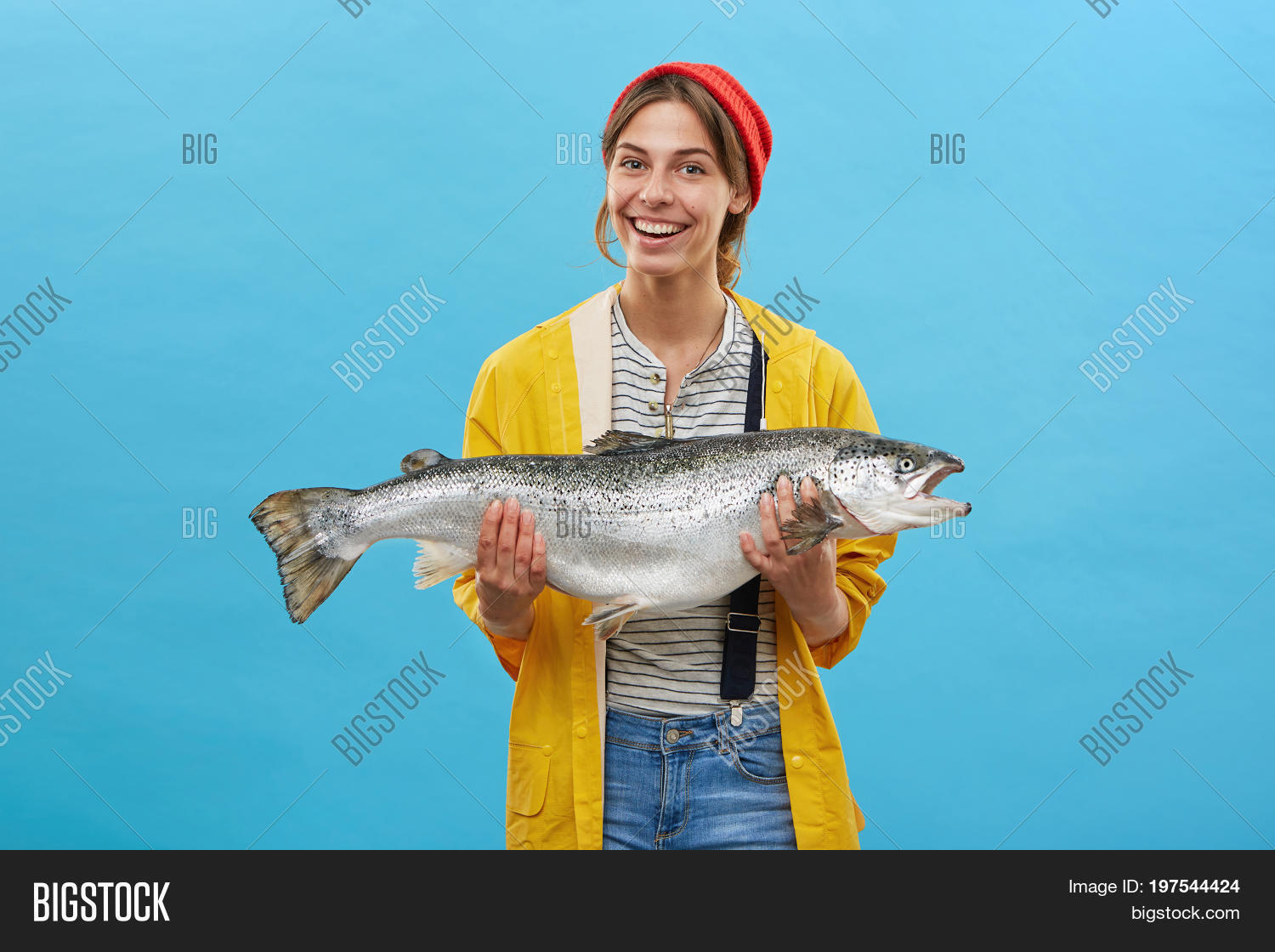 action,activity,adult,angler,angling,background,beautiful,big,blue,catch,expression,eyes,face,female,fin,fish,fisherwoman,fishing,food,fresh,girl,hand,happy,hat,hobby,holding,huge,jacket,joyful,leisure,one,overalls,people,person,portrait,pretty,raincoat,recreation,red,sea,showing,smiling,standing,summer,tasty,trout,vacation,woman,yellow,young