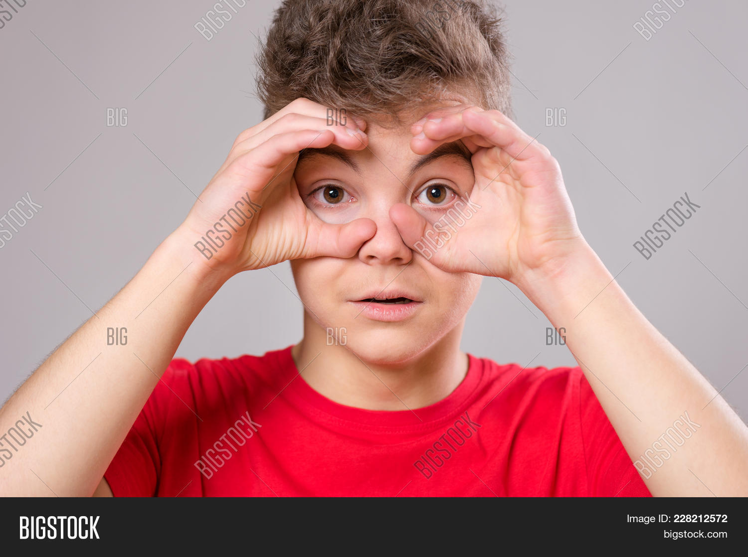 adorable,amazed,amazement,background,binoculars,boy,caucasian,child,childhood,closeup,expression,expressive,eye,face,facial,fingers,frame,fun,funny,gesture,gray,guy,hands,happy,head,humor,leisure,look,male,man,modern,people,portrait,pupil,schoolboy,shock,sign,spyglass,student,surprised,teen,teenage,teenager,through,unbelievable,view,white,wide,wow,young