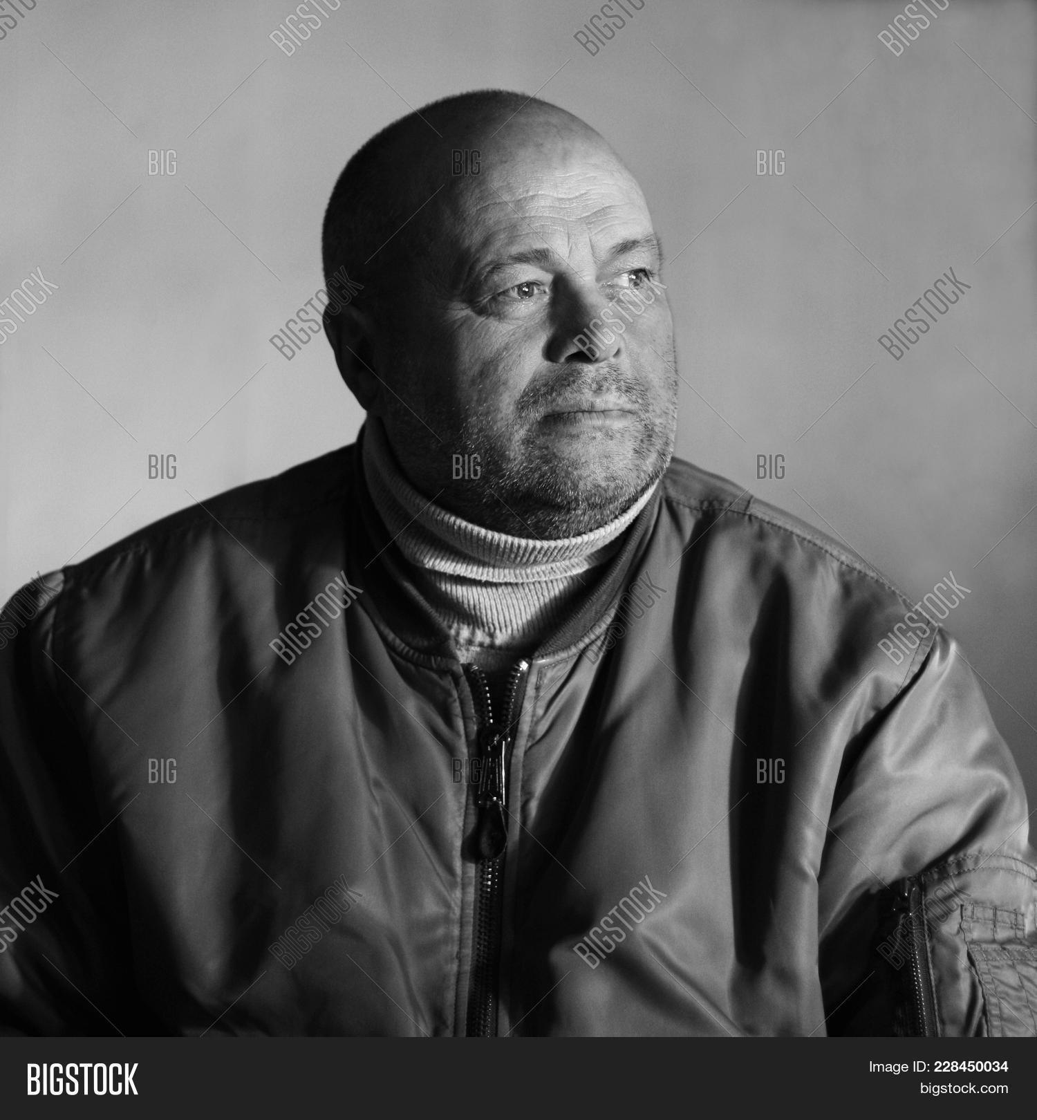 analog,and,bald,black,broad-shouldered,brutal,clothing,distance,dream,face,forehead,grunge,hairless,head,hope,into,jacket,job,large,left,look,male,man,mature,middle-aged,mighty,portrait,proletarian,proletariat,round,severe,shaved,simple,style,sweater,turn,white,work,worker,wrinkles