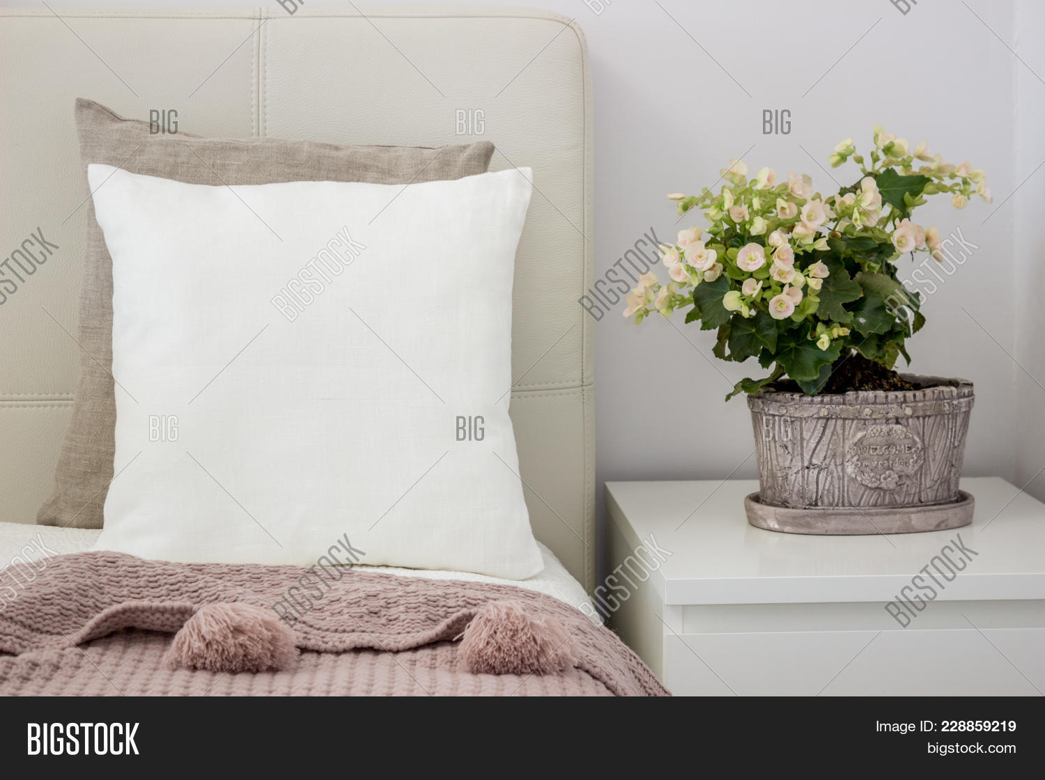 White Pillow On Bed In A Cozy Bedroom Mockup 228859219