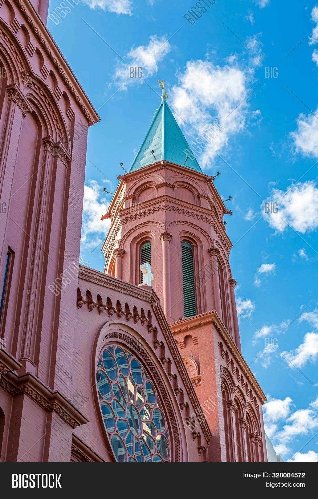 architecture,bell,blue,brick,building,cathedral,catholic,christian,christianity,church,city,destination,exterior,historic,landmark,old,outdoor,red,religious,sky,stone,tourism,tower,traditional,travel