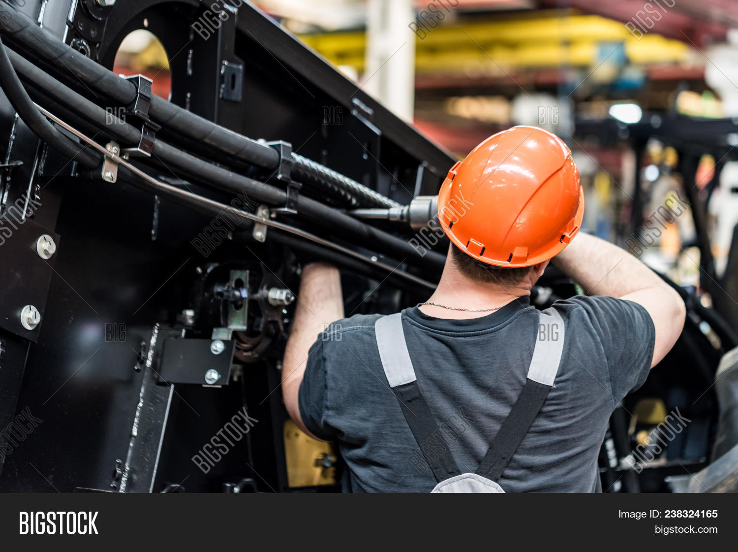 agricultural,assembler,assembly,business,car,cogwheel,construction,conveyer,engine,engineer,engineering,equipment,factory,gear,hand,harvester,heavy,indoors,industrial,industry,laborer,machine,machinery,man,manufacture,manufacturing,mechanic,metal,modern,occupation,operator,person,plant,production,protective,repairman,service,serviceman,set,technician,technology,tractor,transportation,unit,vehicle,wheel,work,worker,workman,workshop