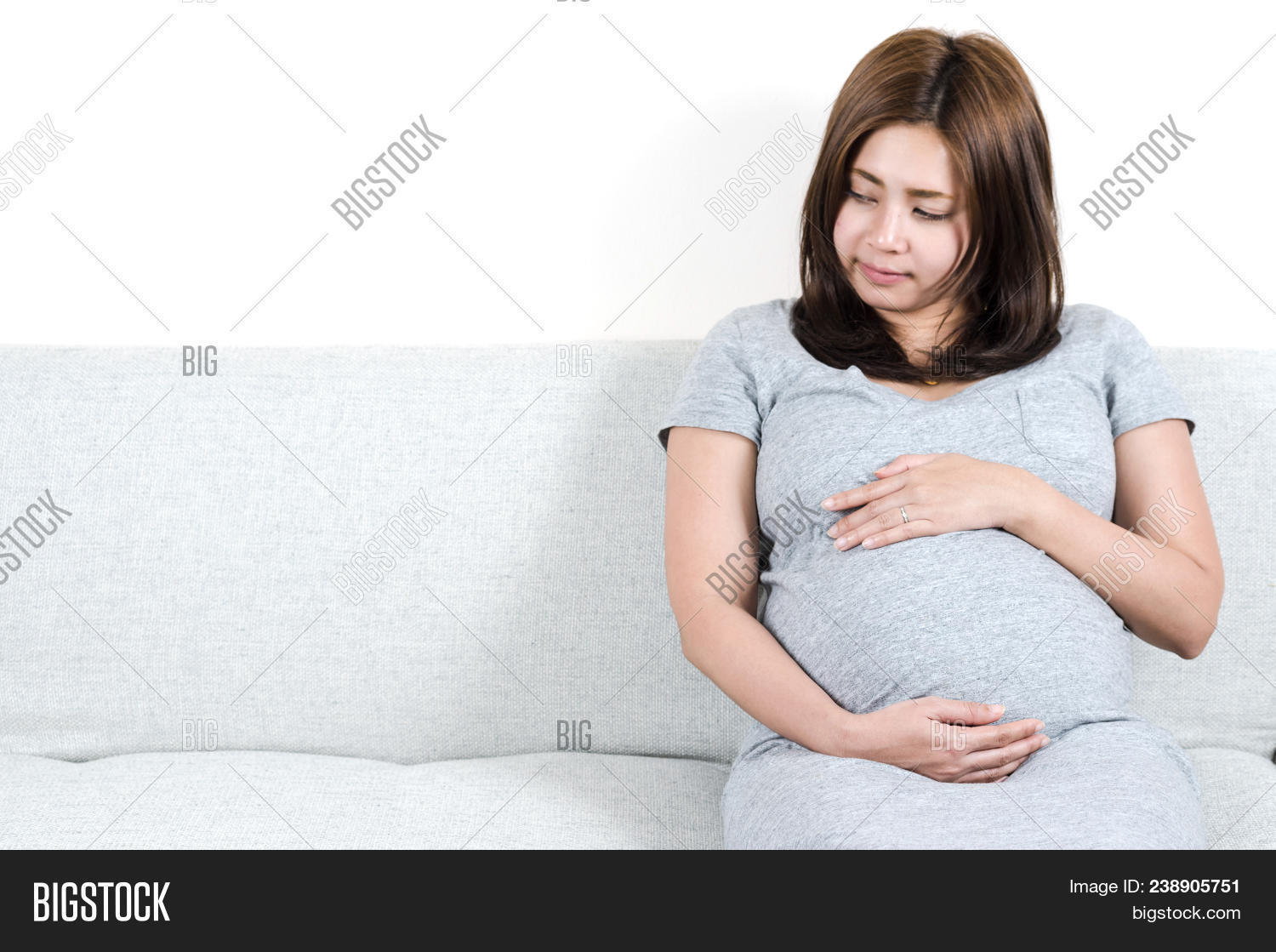 abdomen,adult,anticipation,awaiting,baby,background,beautiful,beauty,bed,bedroom,belly,birth,body,care,caucasian,child,concept,expectant,expecting,family,female,hands,happy,healthy,holding,home,house,human,leisure,life,lifestyle,love,maternal,maternity,mom,mother,motherhood,parent,parenthood,people,person,pregnancy,pregnant,relax,sitting,smiling,tummy,white,woman,young