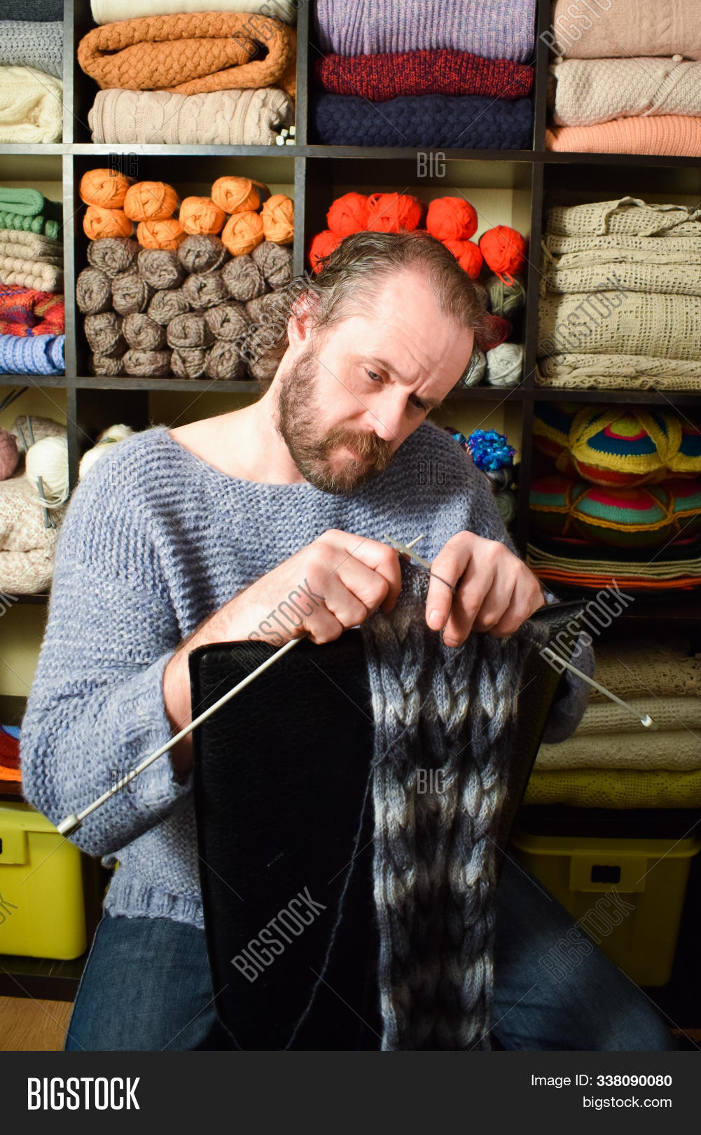 40,50,adult,background,bearded,caucasian,clothing,colorful,concept,cotton,craft,creative,elderly,european,fashion,hand,handmade,hobby,human,knit,lifestyle,male,man,men,mustache,needle,needlework,norwegian,old,one,people,person,red,scarf,sweater,white,wool,work,yarn,year