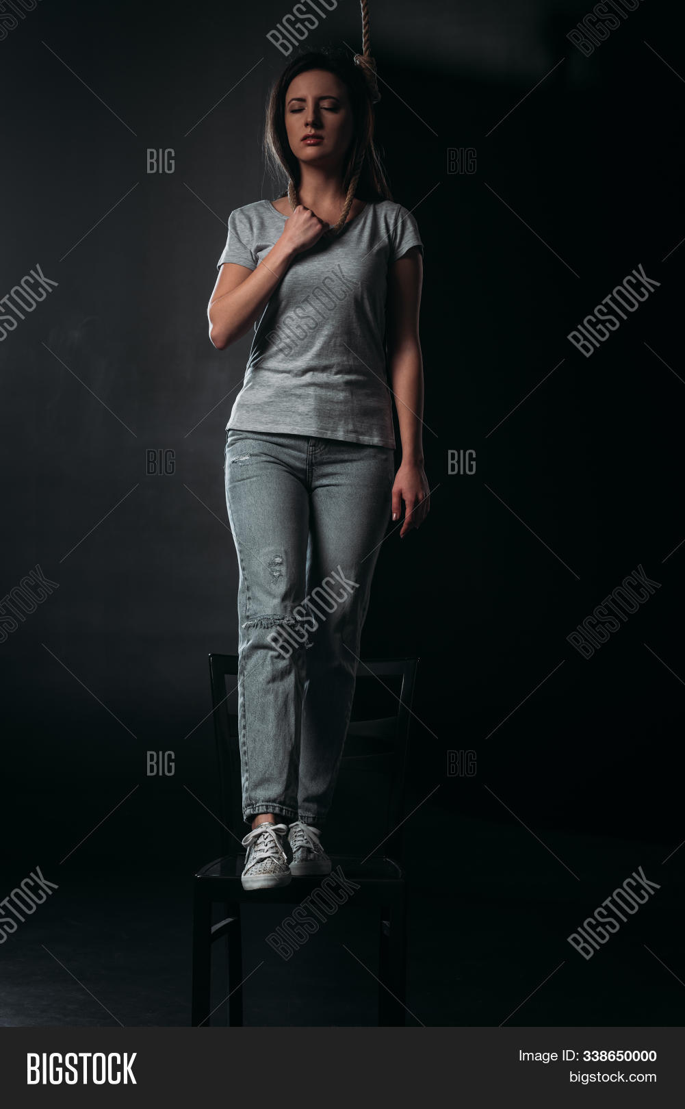 Jeans,Loop,black,caucasian,chair,commit,committing,dark,darkness,denim,depressed,depression,despair,despaired,disappointment,emotion,emotional,european,fatalism,frustrated,gibbet,hang,hanging,hopeless,hopelessness,loneliness,lonely,mental,night,noose,problem,psychical,psychological,rope,self-destroyer,self-killing,self-murder,stand,stress,stressed,suicide,tendency,tragedy,woman