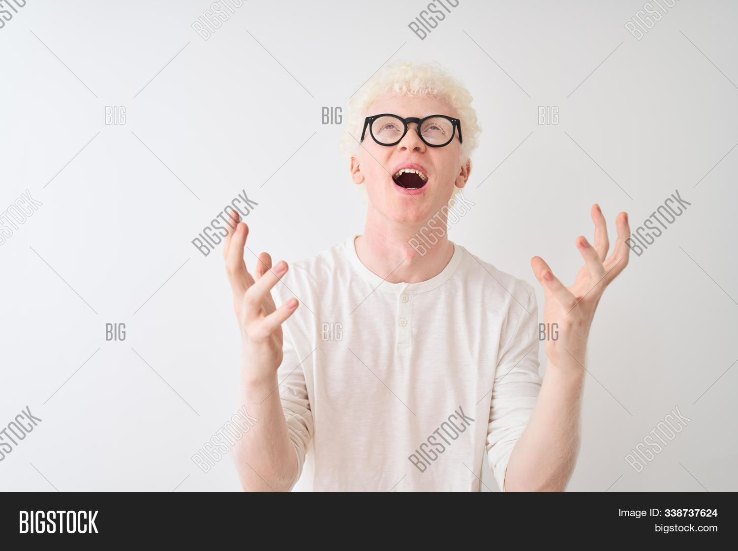 aggressive,albinism,albino,anger,angry,arms,bad,bleached,blind,blond,casual,caucasian,crazy,curly hair,emotion,emotional,expression,frustrated,frustration,furious,gesture,glasses,handsome,illness,isolated,mad,mouth,negative,pale,portrait,rage,raised,sad,scream,shout,shouting,standing,stress,stressed,t-shirt,unhappy,upset,white,yelling,young