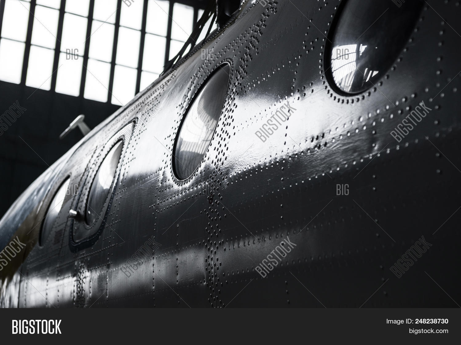 aircraft,aluminum,aviation,clincher,cover,covering,engineering,fuselage,hangar,hull,maintenance,metal,old,plane,porthole,rivet,service,sheathing,steel,surface,texture,transport