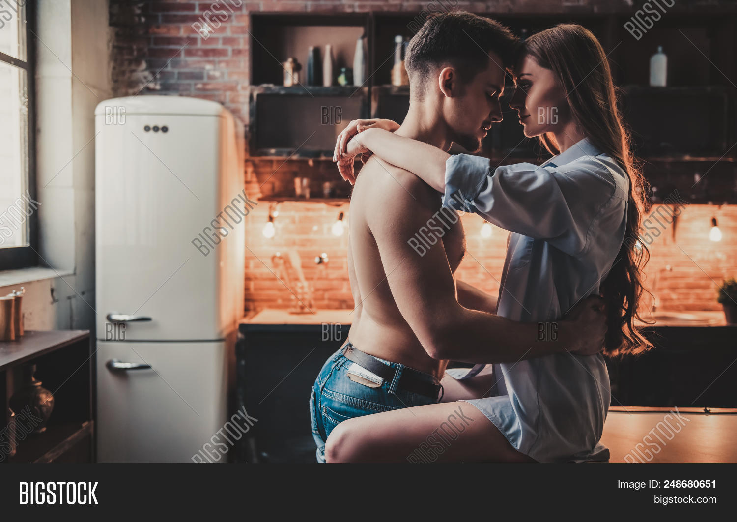 adult,athlete,athletic,bare,body,chest,closeness,concept,couple,fit,frige,guy,handsome,happy,healthy,home,hug,hugging,indoor,kitchen,lifestyle,love,man,modern,muscle,muscular,person,red,relationship,romantic,sensual,shirtless,sitting,standing,together,topless,torso,wine,woman,young