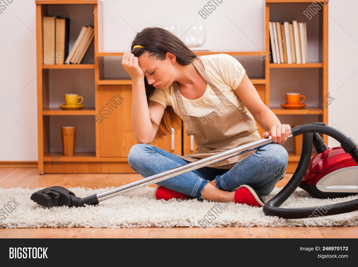 adult,apron,bored,brown,carpet,caucasian,chores,clean,cleaner,cleaning,closed,displeased,equipment,exhausted,eyes,female,floor,frustrated,girl,hair,home,house,housewife,indoor,interior,lazy,one,person,room,sitting,tired,up,vacuum,woman,young