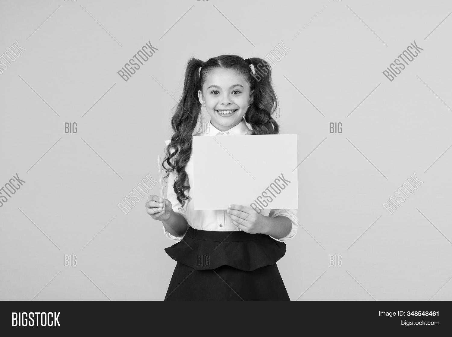 writing,write,paper,school,child,writer,handwriting,calligraphy,knowledge,skills,lecture,task,exercise,lesson,literacy,education,learn,learning,homework,startup,formal,informal,non-formal,study,schoolchild,schoolgirl,girl,baby,kid,childhood,cute,pen,presenting,empty,blank,sheet,yellow,background