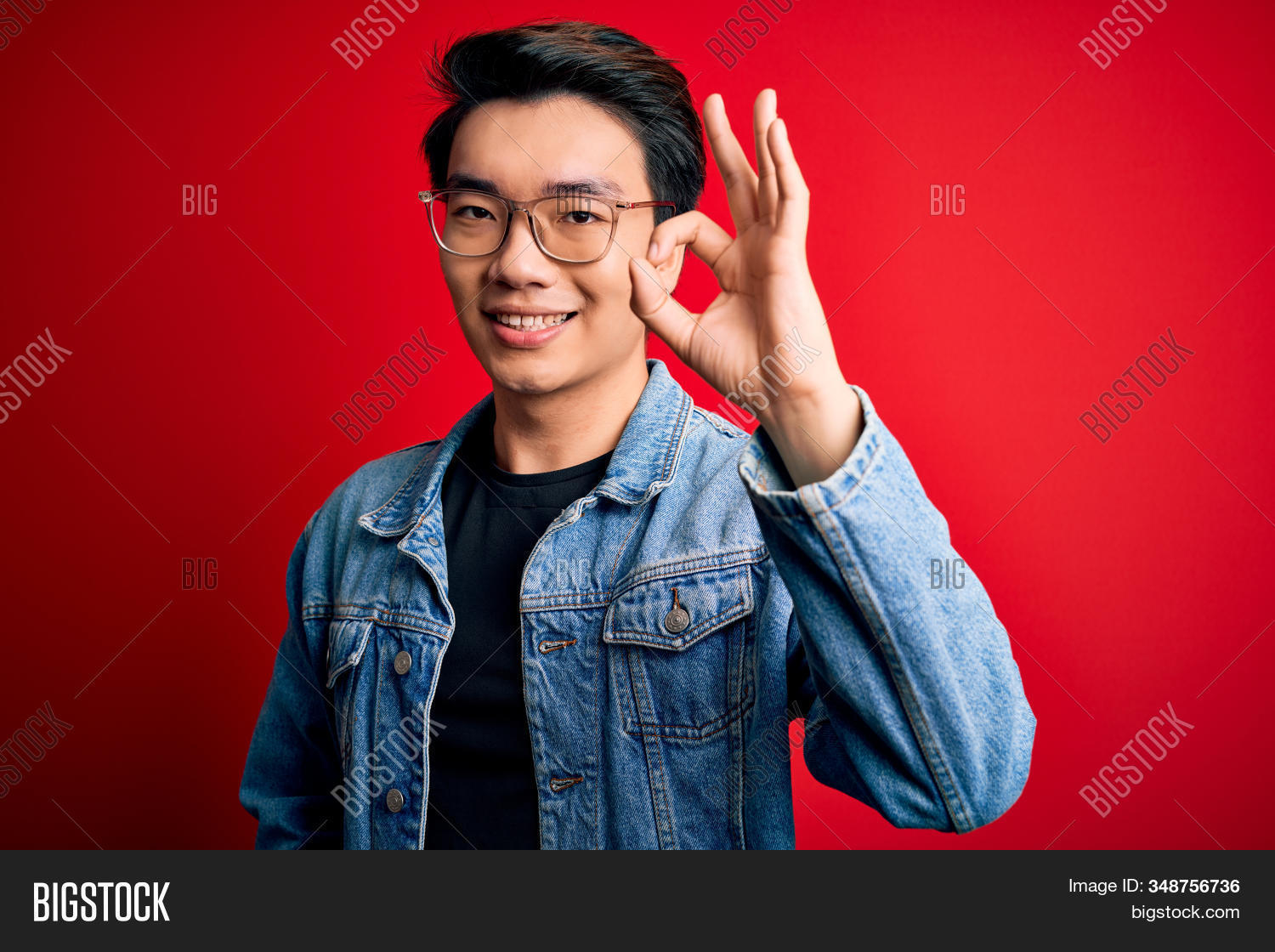 adult, 																					agree, 																					approve, 																					asian, 																					attractive, 																					background, 																					casual, 																					cheerful, 																					chinese, 																					confident, 																					cool, 																					denim, 																					doing, 																					expression, 																					face, 																					fashion, 																					finger, 																					fingers, 																					friendly, 																					fun, 																					gesture, 																					glasses, 																					good, 																					great, 																					hand, 																					handsome, 																					happiness, 																					isolated, 																					jacket, 																					looking, 																					male, 																					man, 																					natural, 																					ok, 																					okay, 																					people, 																					person, 																					portrait, 																					positive, 																					red, 																					shirt, 																					showing, 																					sign, 																					smile, 																					smiling, 																					standing, 																					success, 																					successful, 																					yes, 																					young