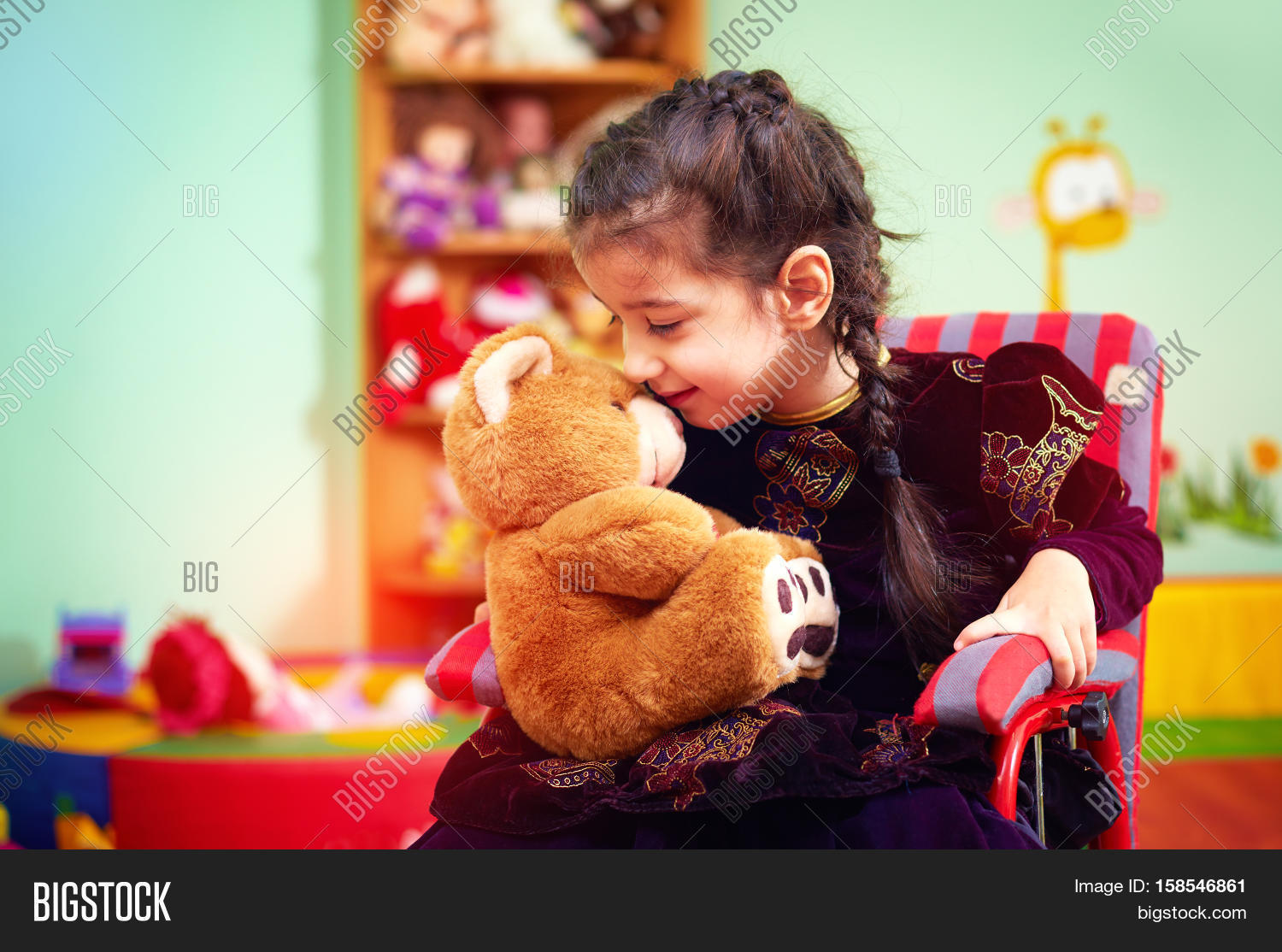 Cute Little Girl In Wheelchair Telling Her Secret To Plush Bear In