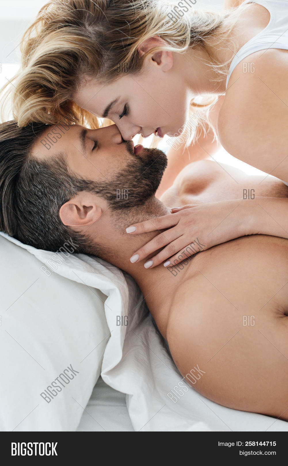 able,adult,affection,at,attractive,bearded,beautiful,bed,bedroom,boyfriend,caucasian,closeness,couple,female,girl,girlfriend,handsome,happy,home,indoors,kiss,love,lovers,lying,male,man,passion,passionate,people,pretty,relationship,seductive,sexy,side,to,together,togetherness,view,woman,young