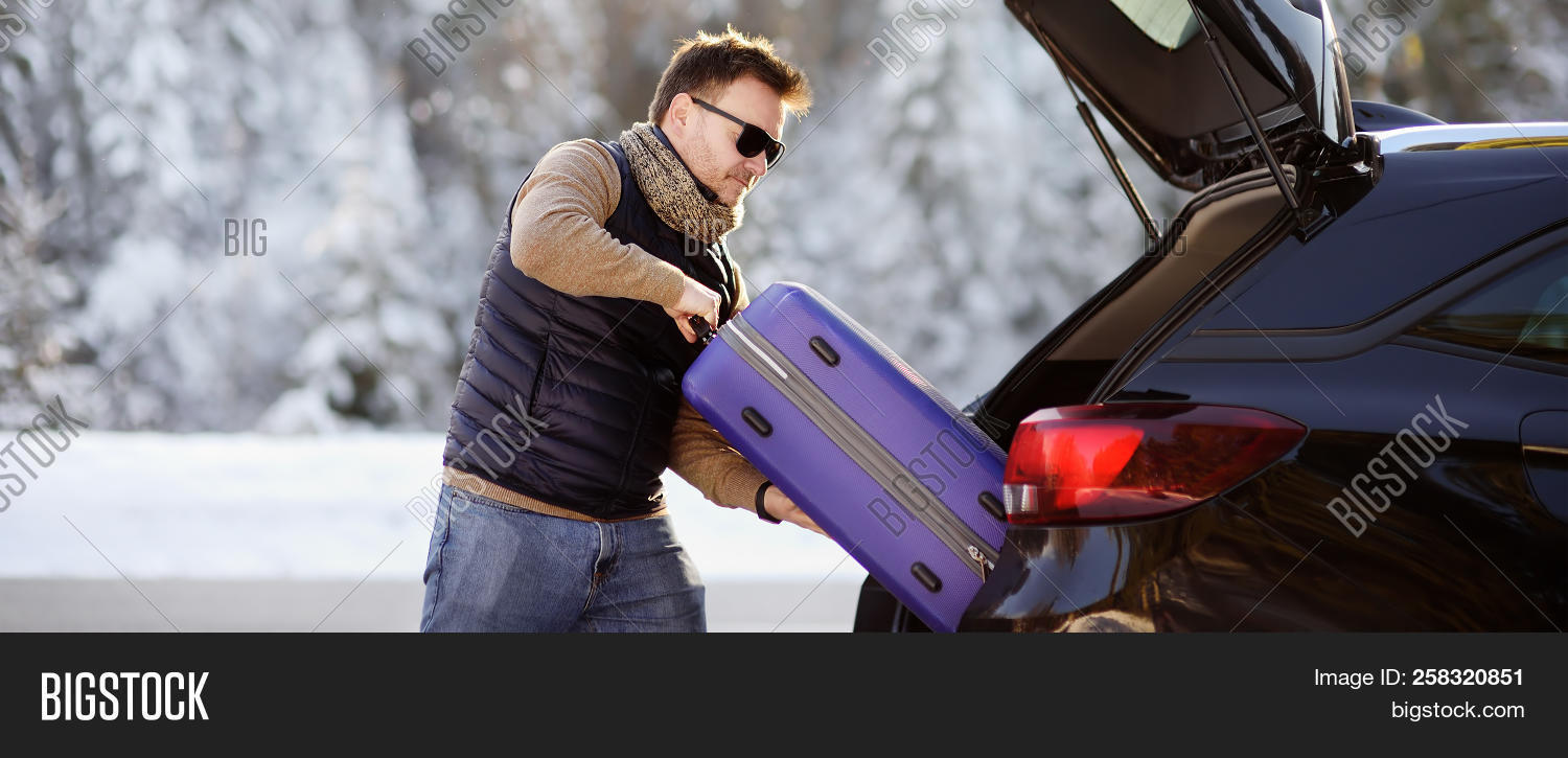 adult,alpine,alps,auto,automobile,baggage,banner,bavaria,bavarian,camping,car,case,caucasian,country,countryside,destination,german,germany,holiday,journey,load,luggage,male,man,mountains,opened,outdoors,outside,pack,person,ready,rest,ride,road,snow,snowy,suitcase,tourism,tourist,transportation,travel,trip,trunk,vacation,vehicle,voyage,wanderlust,weekend,winter,wintertime