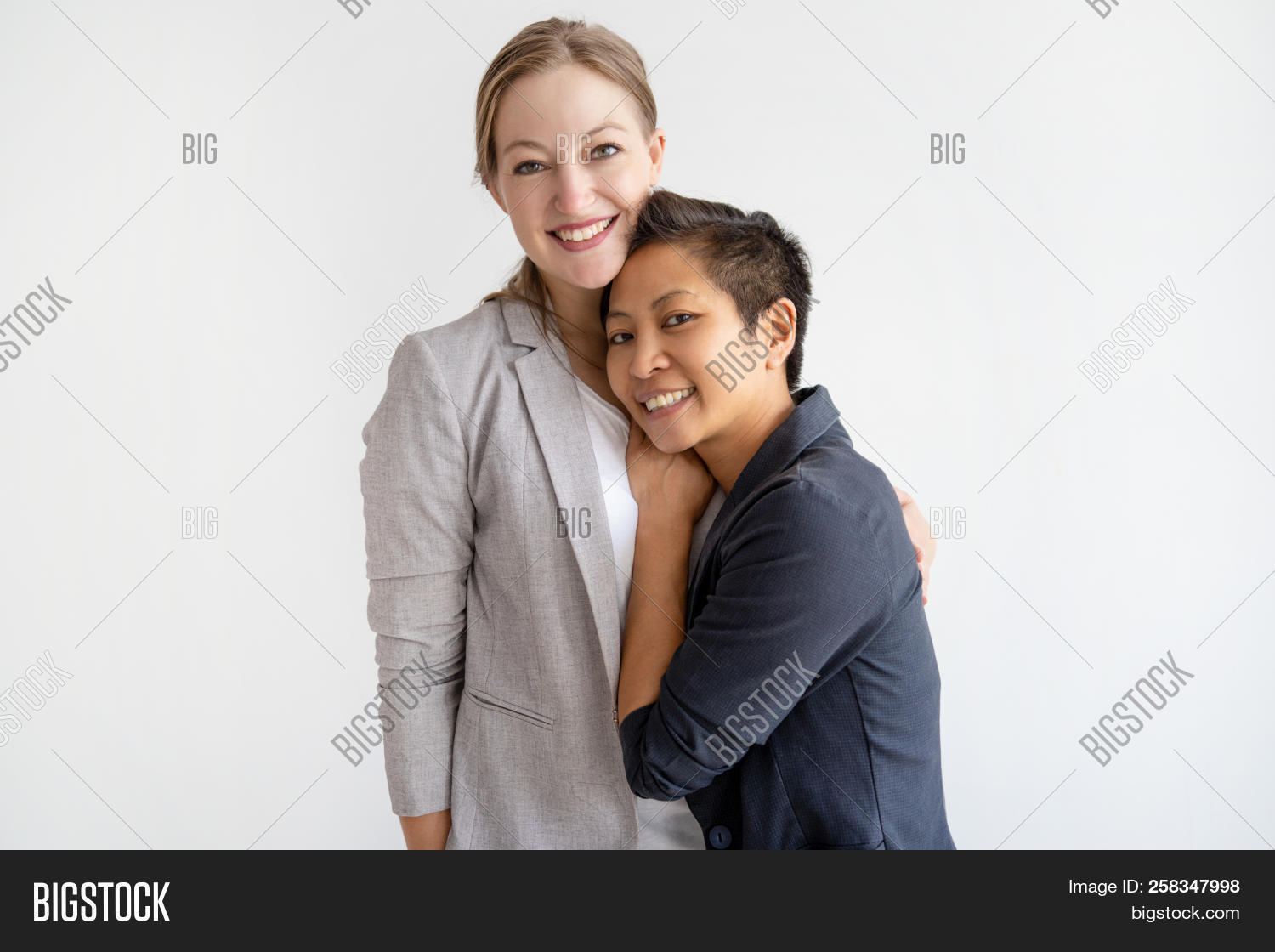 Asian,Caucasian,adult,affectionate,attractive,background,bisexual,calm,camera,concept,content,couple,dating,diverse,embracing,family,feeling,female,friend,friendship,front,girl,girlfriend,group,happy,homosexual,horizontal,hugging,jacket,lady,lesbian,lifestyle,looking,love,multiethnic,people,portrait,posing,positive,relationship,romance,smiling,standing,studio,tenderness,together,two,woman,young