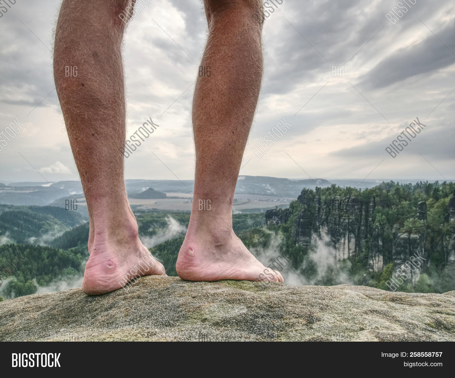 agnail,artery,blister,blue,body,bos,boy,calf,cold,fall,feet,fog,foggy,foot,ground,hairy,heel,hiking,leg,male,man,misty,moment,morning,mountain,nail,naked,outdoor,pain,peak,person,rest,rock,rocky,sandstone,shoeless,siesta,skin,sore,sports,summit,tendon,thumb,trekking,valley,vein,walker,watching,weather
