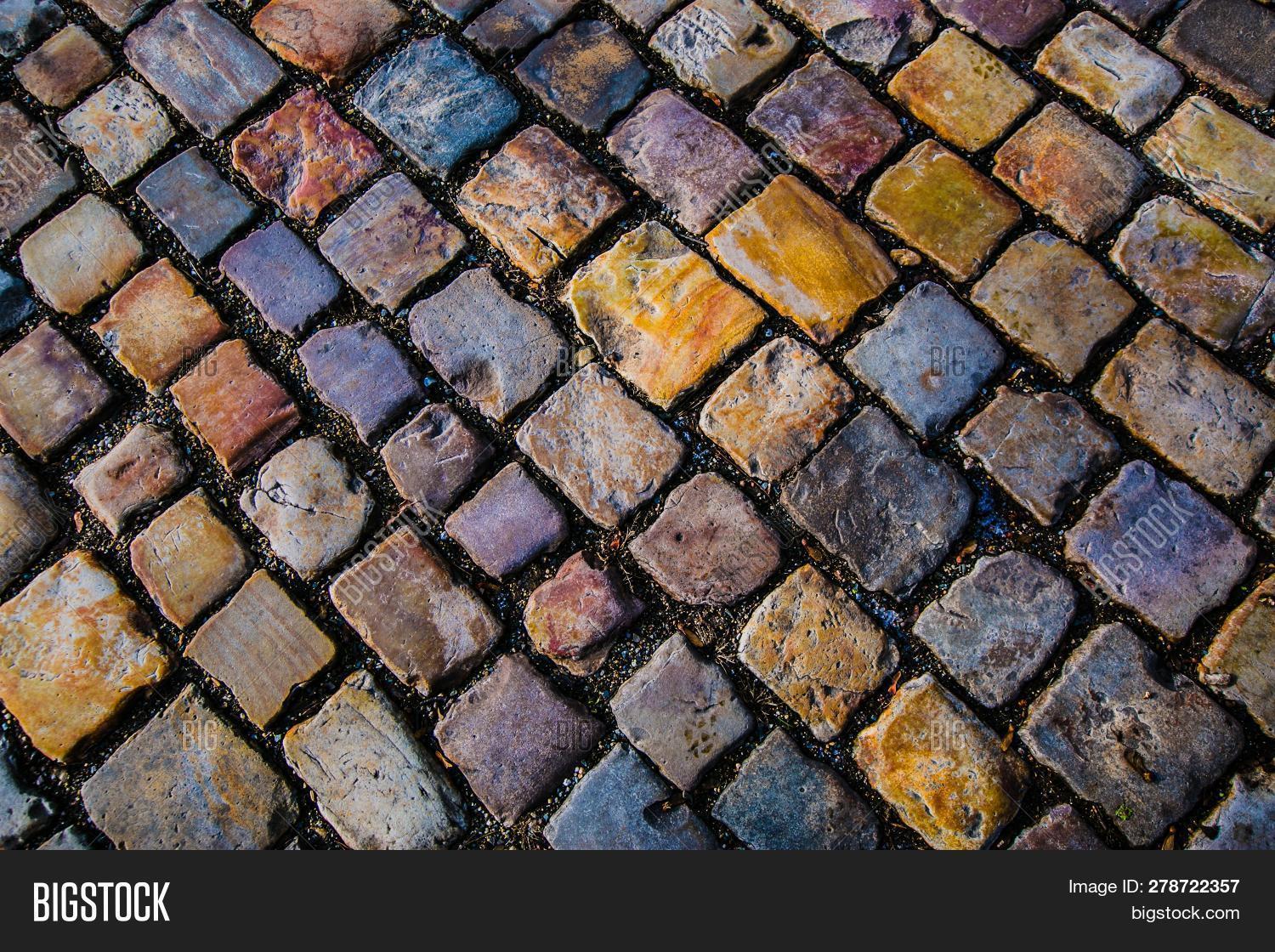 abstract,across,background,bike,block,blue,brick,city,cobblestone,colorful,construction,design,dirt,european,floor,gray,grey,ground,material,old,orange,original,pattern,pavement,paving,piece,prague,purple,rectangle,rectangular,red,road,rock,shape,sidewalk,square,stone,street,surface,texture,top,typical,view,violet,white,yellow