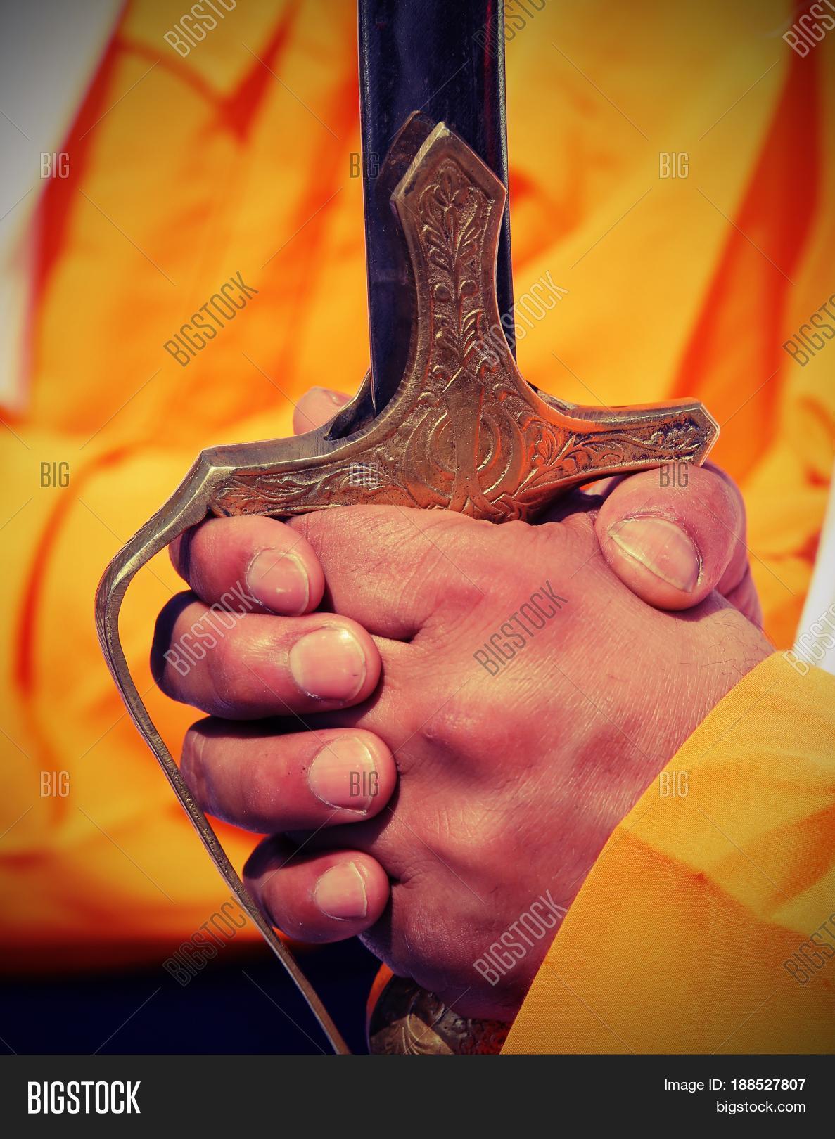 baisakhi,celebration,effect,fingers,guard,guru,hand,handle,hilt,india,kirtan,lomo,lomography,man,nagar,nanak,panentheism,panjab,people,person,pommel,punjab,rapier,religion,religious,sick,sikh,sikhi,sikhism,spirituality,sword,vaisakhi,vintage,weapon
