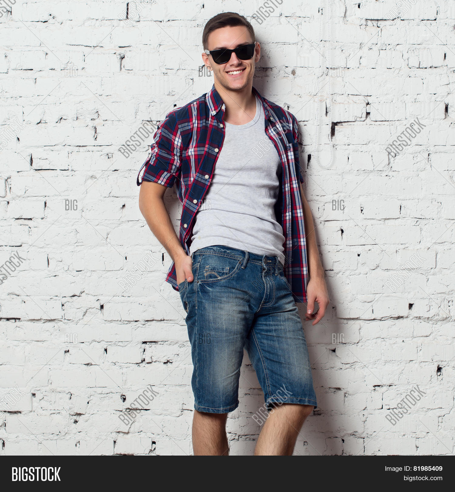 Handsome Stylish Young Man In Jeans Shorts And Shirt