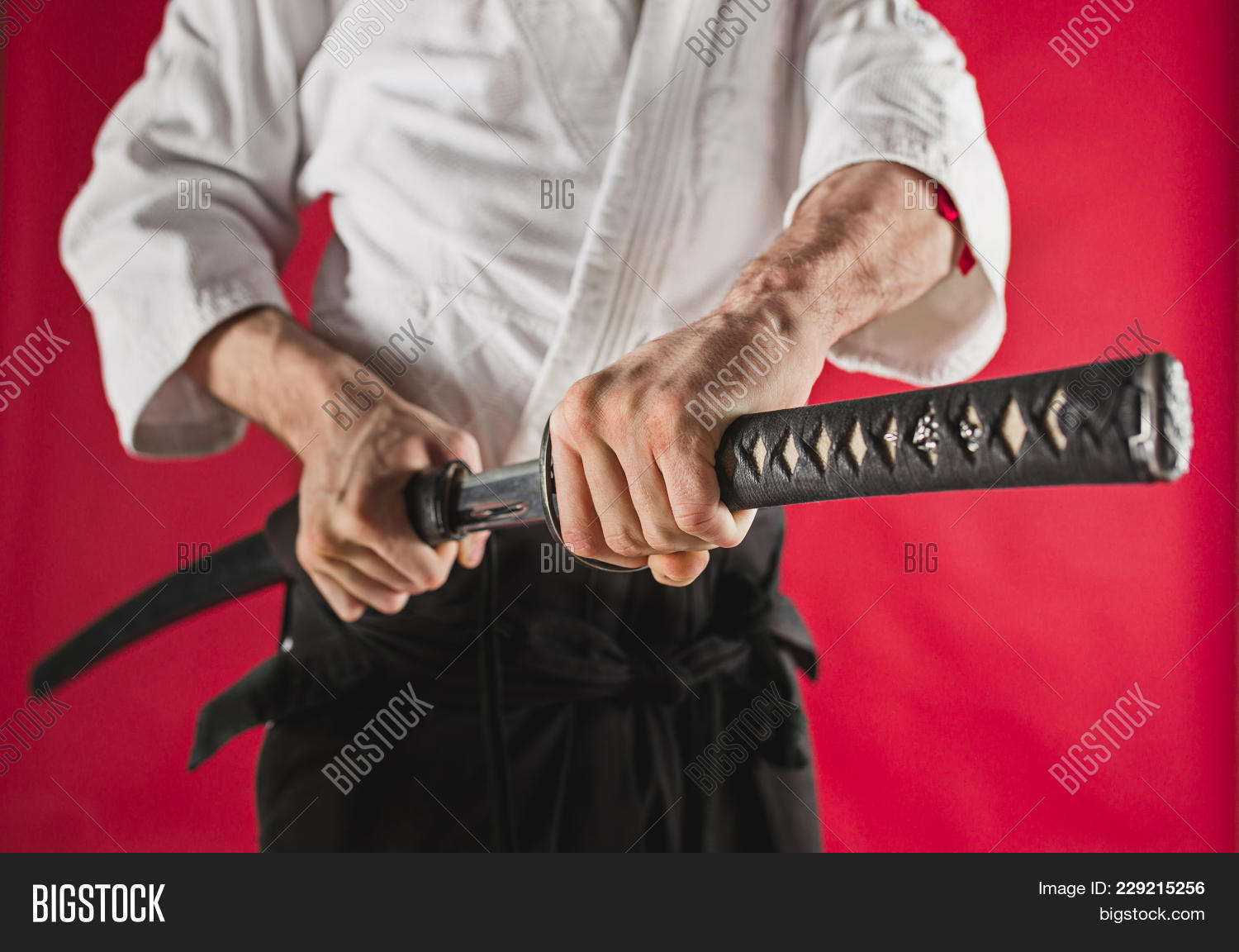 Healthy,Karate,adult,aikido,are,arm,art,asia,catching,closeup,combat,combative,concentration,defense,equipment,fight,hand,hit,hold,iaido,instruction,isolated,japan,japanese,katana,kendo,kenjutsu,kimono,lifestyle,male,man,martial,master,meditation,ninja,out,posture,practices,pulling,saber,samurai,scabbard,sport,studio,sword,tool,training,warrior,weapon