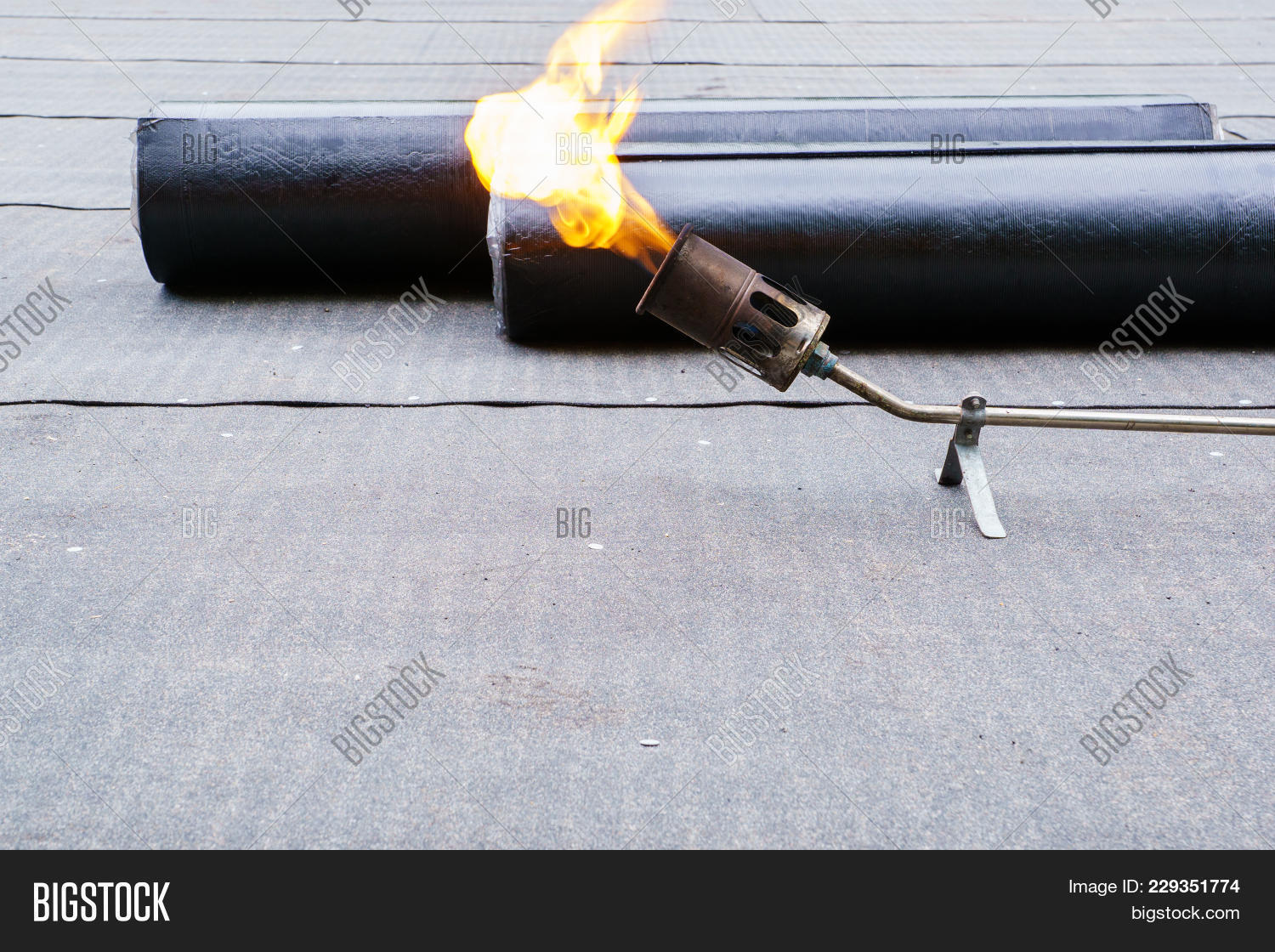 bitumen,blowtorch,building,coating,construction,covering,felt,fire,flame,flat,fuel,gas,industry,insulation,propane,repair,roll,roof,roofer,roofing,site,surface,tar,technology,tool,torch,waterproof,waterproofing,work,worker