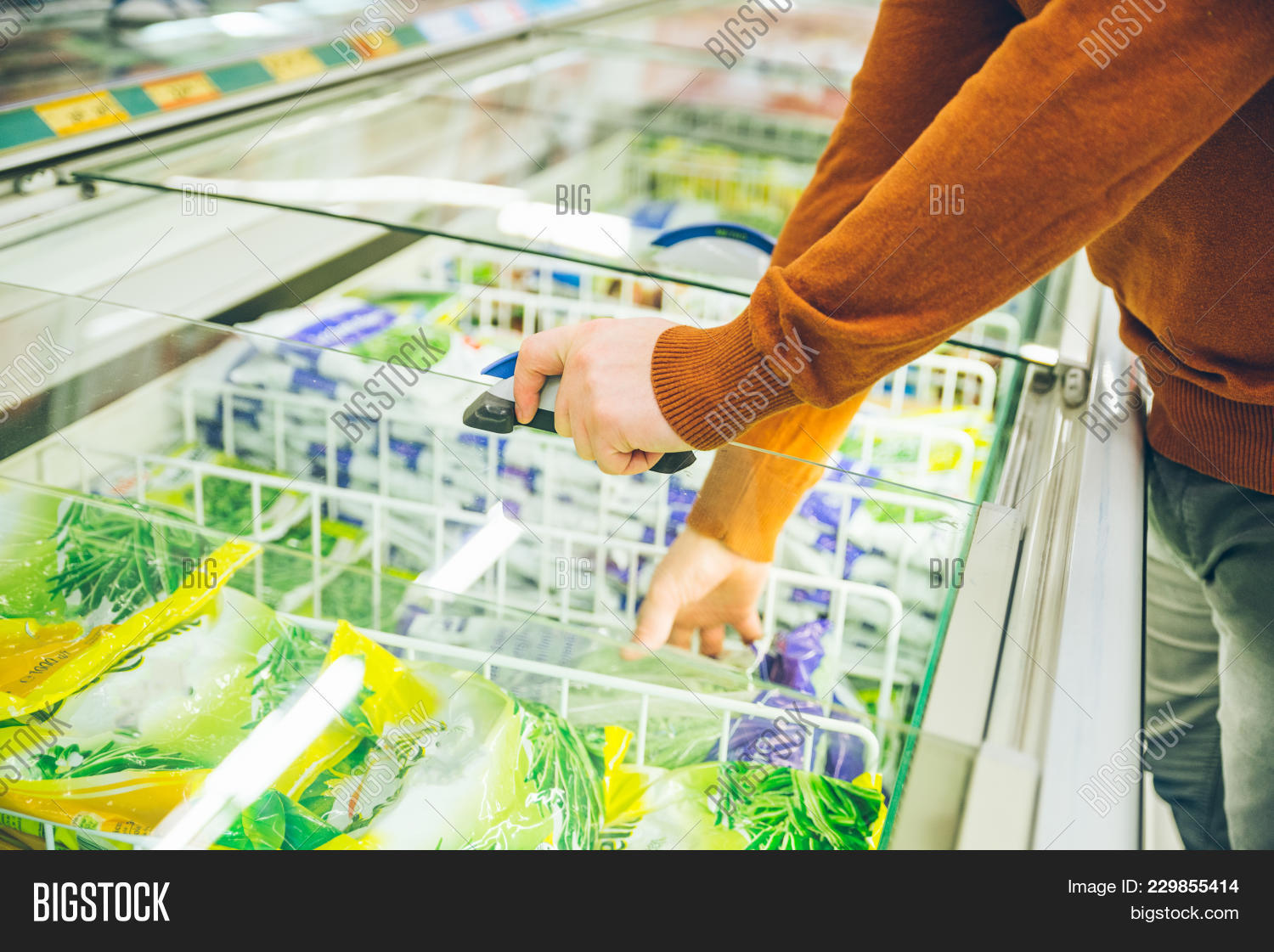 adult,basket,beans,beard,buy,buyer,buying,casual,caucasian,choice,choosing,concepts,confused,consumer,consumerism,contemporary,customer,food,fridge,frost,glasses,goods,groceries,human,label,lifestyles,looking,mall,man,market,one,people,person,photography,picking,product,pursuit,reading,retail,routine,shelf,shipment,shop,shopping,store,strong,supermarket,young