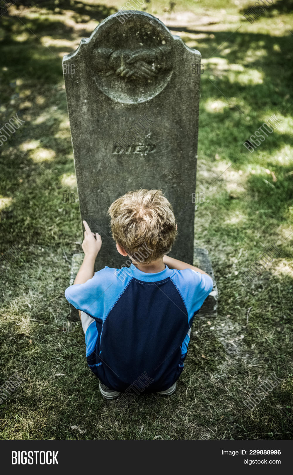 ancestor,ancestry,boy,burial,cemetery,dead,death,died,forefathers,funeral,genealogy,grass,grave,gravesite,graveyard,headstone,history,looking,loss,memorial,memory,monument,mourning,old,passing,past,peaceful,remember,remembrance,rest,rip,stone,symbol,text,tomb,tombstone,understanding,vintage
