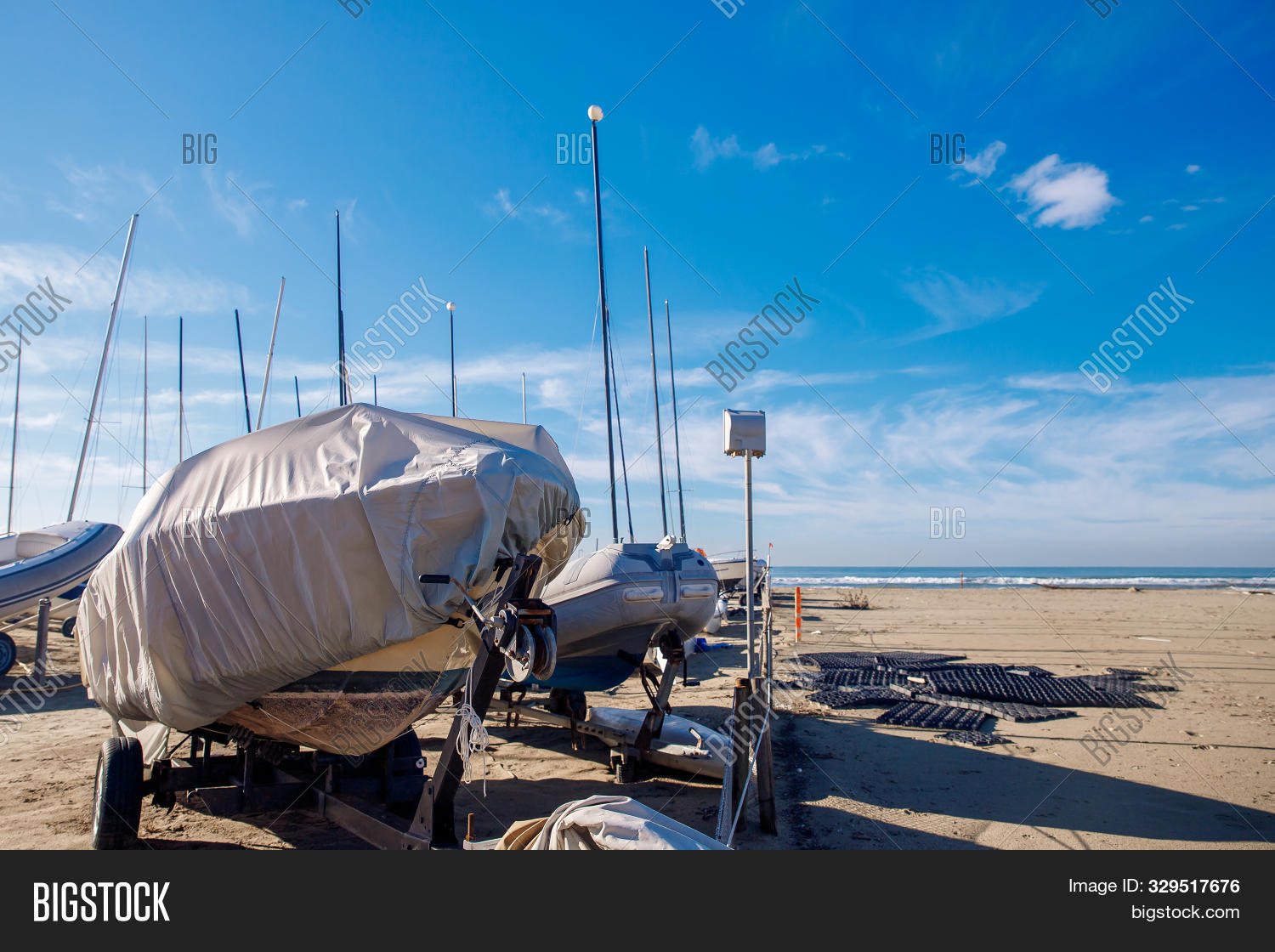 autumn,awning,blue,boat,bow,bright,conservation,cover,dock,fall,foliage,glare,hull,iron,jetty,ladder,leisure,marine,nautical,pier,power,protect,protection,recreation,save,secure,shelter,ship,shrink,sport,storage,store,stretch,sunny,swim,taut,tent,trailer,transportation,tree,warehouse,water,winter,winterize,winterizing,wrap