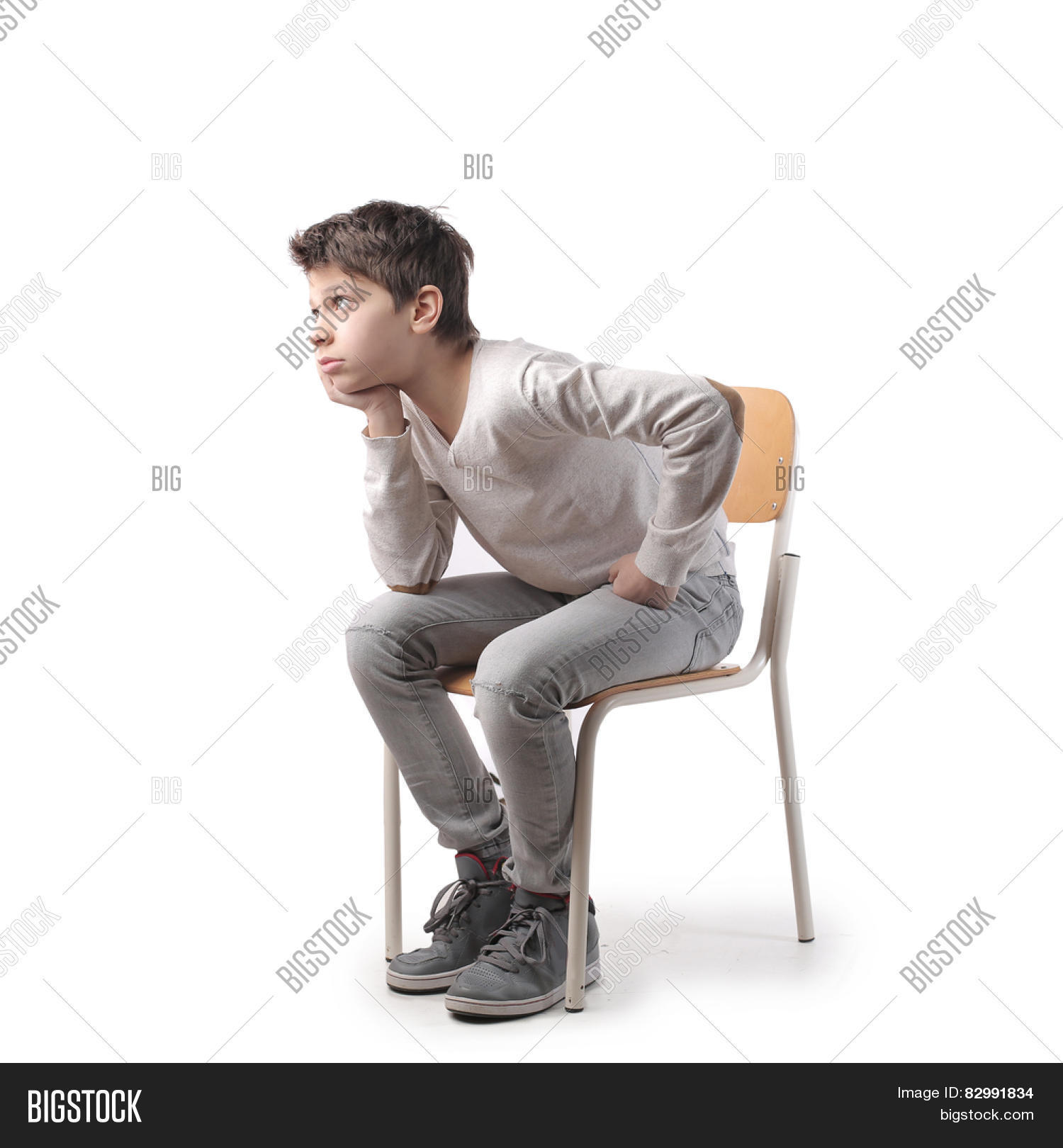 background,body,bored,boy,caucasian,chair,child,childhood,guy,isolated,kid,man,person,sad,sad child,school,study,think,tough,white,young