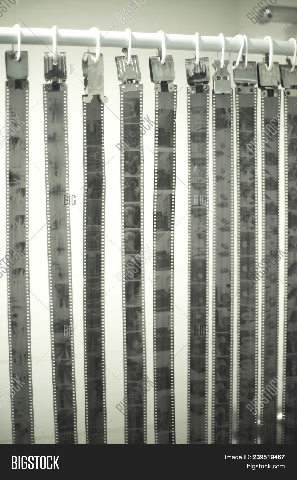 35mm,aged,analog,antique,art,background,bathroom,black,border,camera,cinema,darkroom,development,drying,exposure,film,filmstrip,frame,grain,hanging,holes,home,isolated,laboratory,movie,negative,old,photo,photograph,photography,picture,reel,retro,roll,sprocket,strip,tape,traditional,vintage,white
