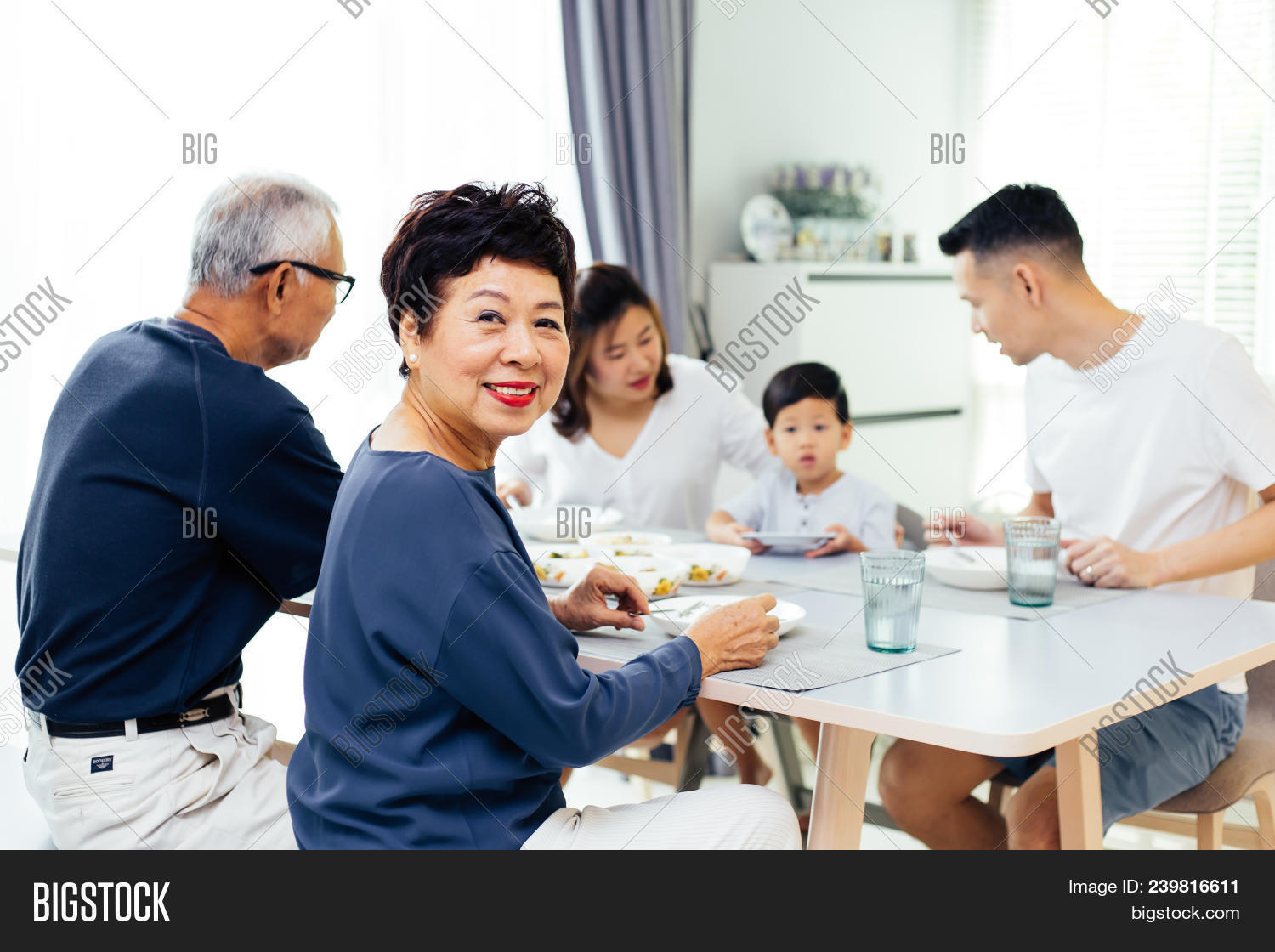 30s,60s,adult,apartment,asian,cheerful,child,chinese,daughter,dinner,eating,enjoying,extended,family,father,feeding,female,food,girl,grandfather,grandparents,grandson,happy,home,house,household,indoors,japanese,joyful,kitchen,laughing,lunch,male,man,mature,meal,mother,parents,people,preparing,smiling,son,standing,table,talking,thai,together,togetherness,woman,young
