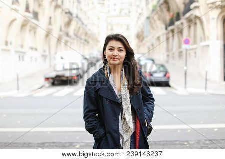 Chinese Cute Girl Standing In Street Background, Walking After Classes. Concept Of International Stu