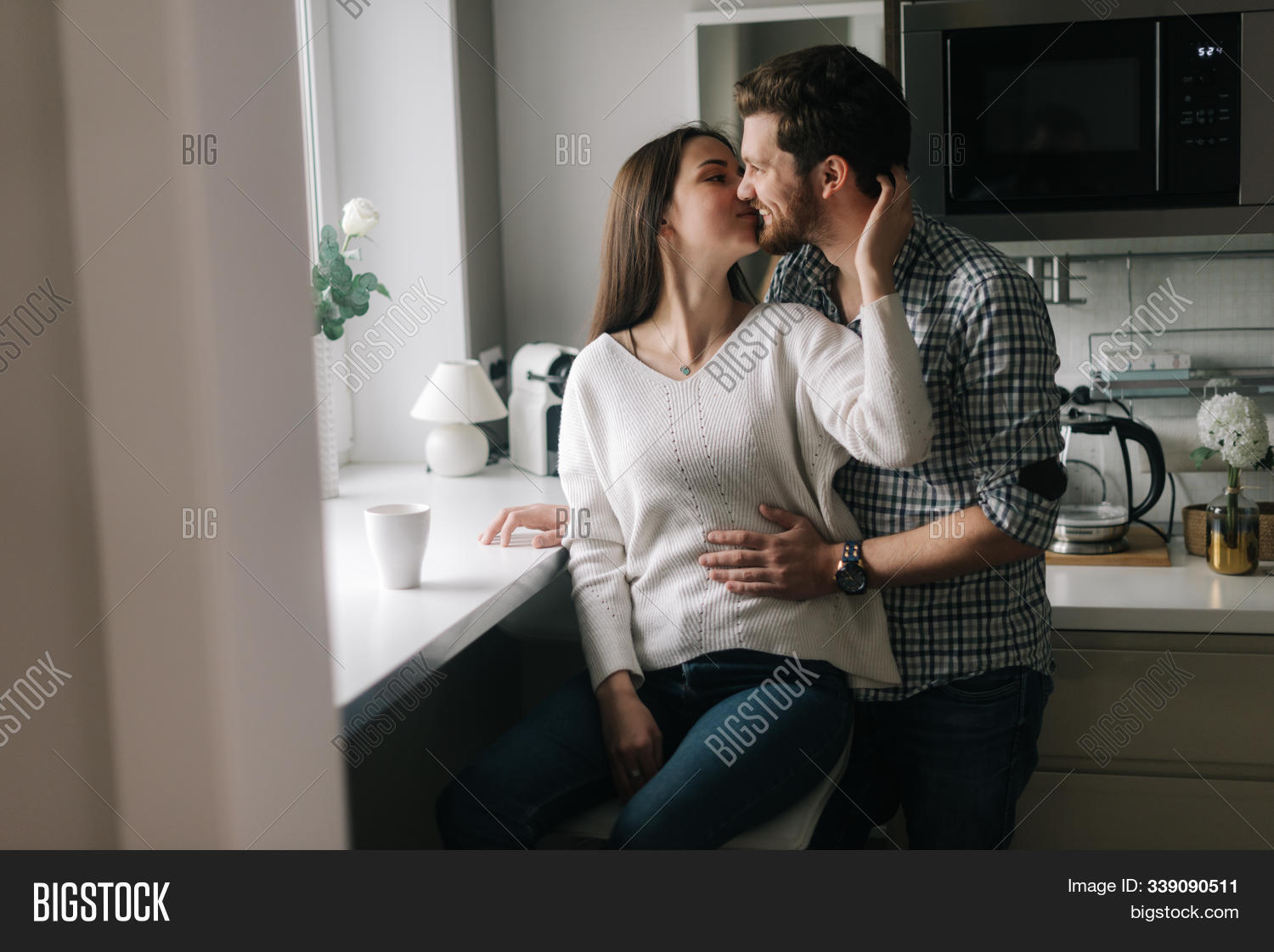 adult,affection,affectionate,apartment,attractive,beautiful,boyfriend,caucasian,cheerful,couple,embracing,family,female,girl,girlfriend,guy,handsome,happy,healthy,home,house,hugging,husband,indoors,interior,kiss,kissing,kitchen,leisure,lifestyle,living,love,male,man,person,portrait,pretty,relationship,romance,romantic,room,sitting,smiling,table,together,two,wife,woman,young